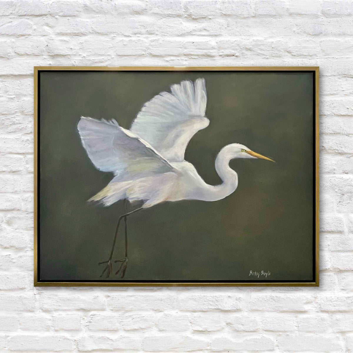 Purpose original oil painting by South Carolina artist Betsy Boyle featuring a great white egret in motion with wings raised against an atmospheric olive green background, framed in gold and available at Gray Man Gallery in Pawleys Island