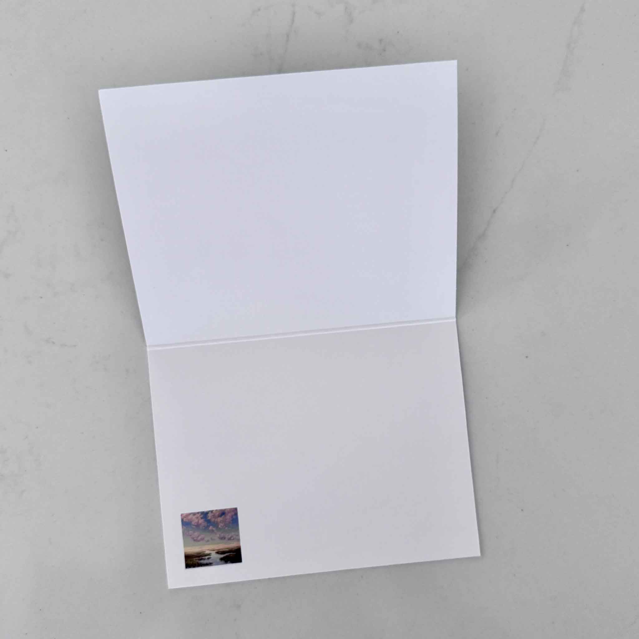 Open notecard showing a blank interior, featuring artwork by local artist Jeanne O’Neal and offered by Gray Man Gallery.