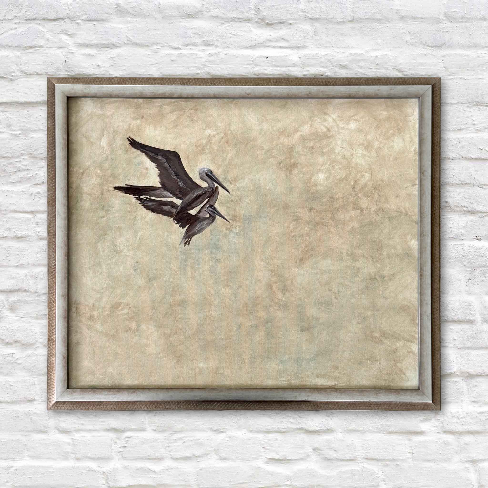 Braden Grafe original oil painting Flight Study I featuring two pelicans in flight against a soft neutral textured background, custom framed artwork at Gray Man Gallery in Pawleys Island showcasing refined Lowcountry coastal art