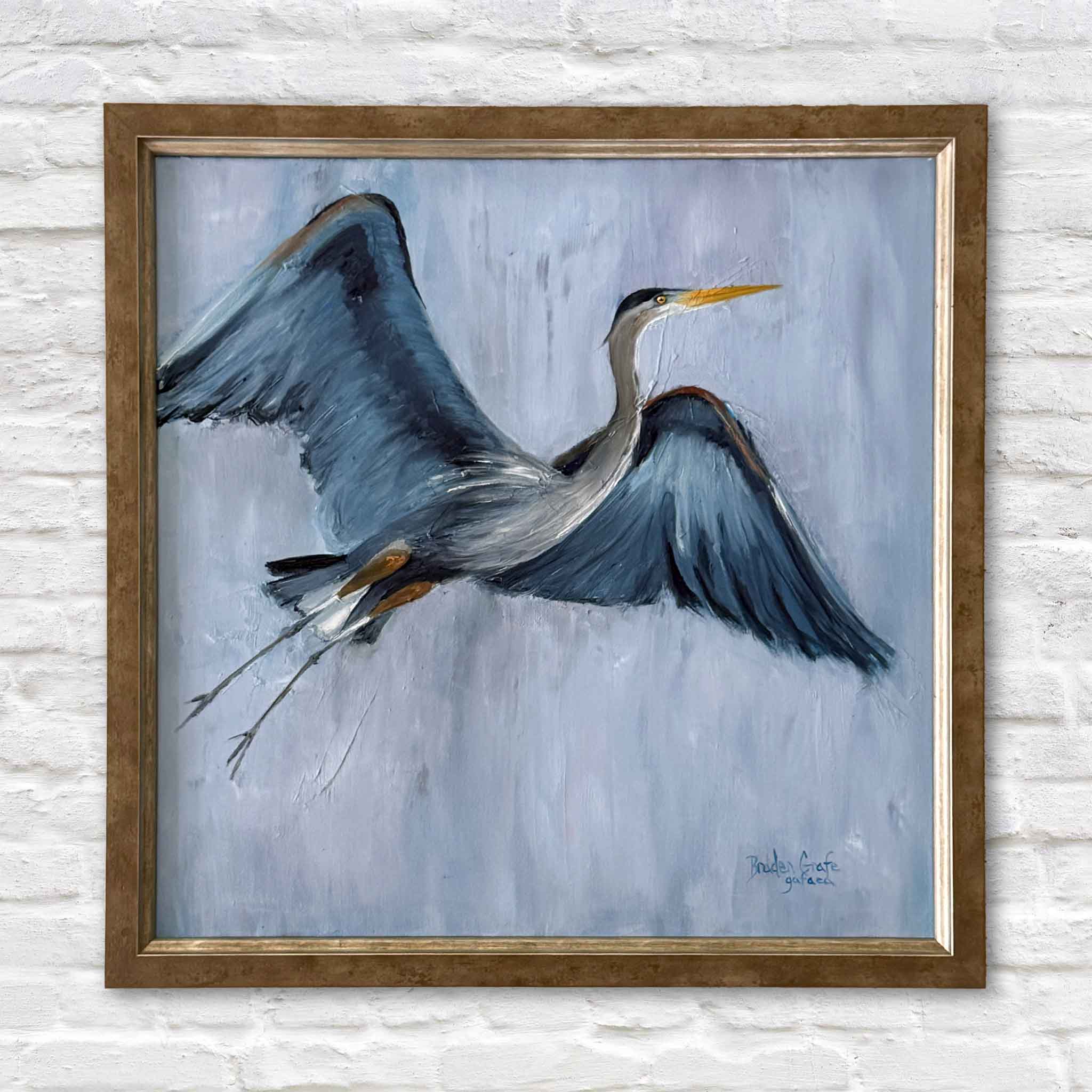 Braden Grafe original oil painting Got the Blues featuring a great blue heron in flight with layered blue and gray tones against a soft atmospheric background, custom framed coastal artwork at Gray Man Gallery in Pawleys Island