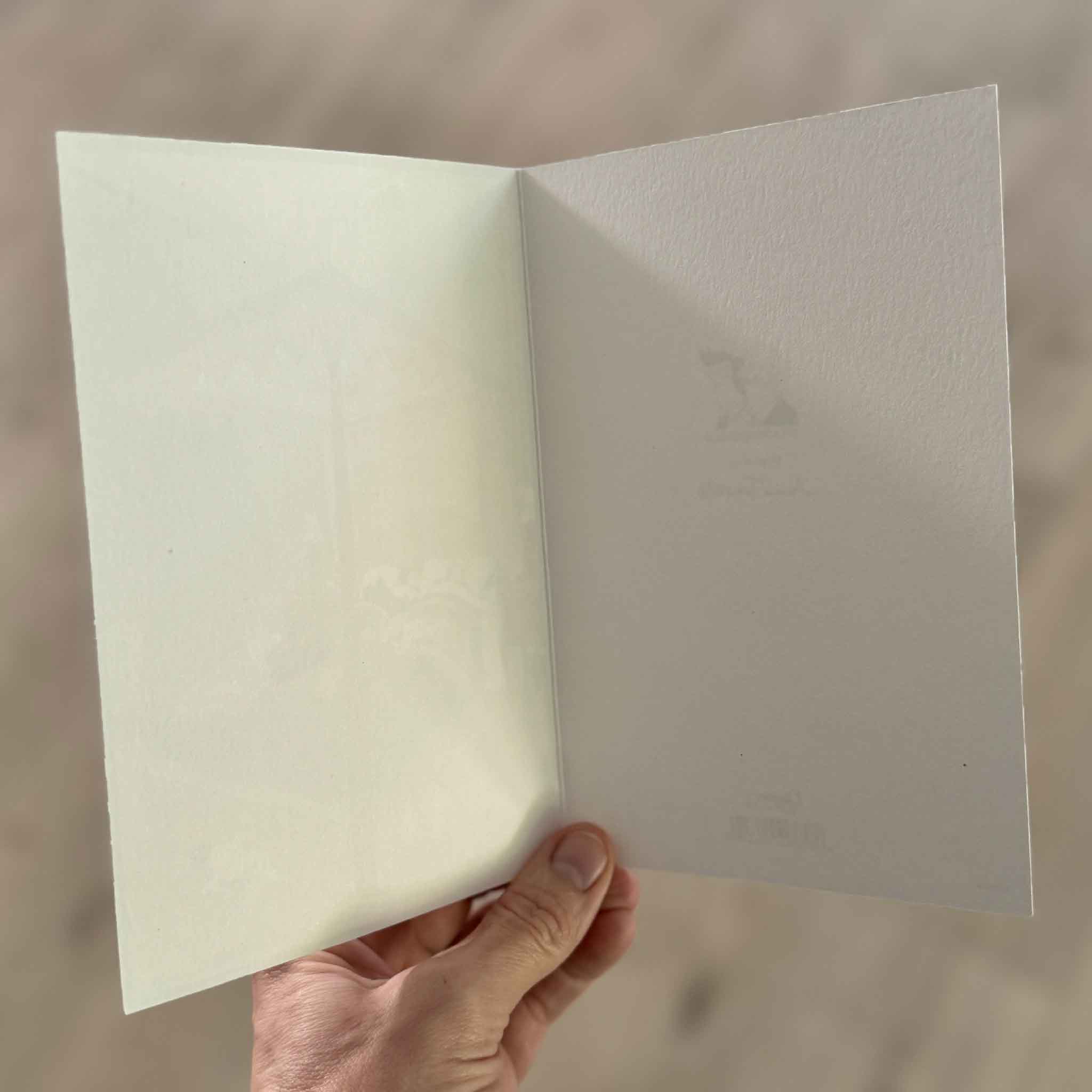 Blank interior of a folded Caspari greeting card featuring artwork by Annie Tempest. The premium heavyweight paper provides ample space for a handwritten message, making it ideal for thank-you notes, birthdays, sympathy cards, congratulations, or everyday correspondence. Printed in the USA and available at Gray Man Gallery in Pawleys Island, South Carolina.