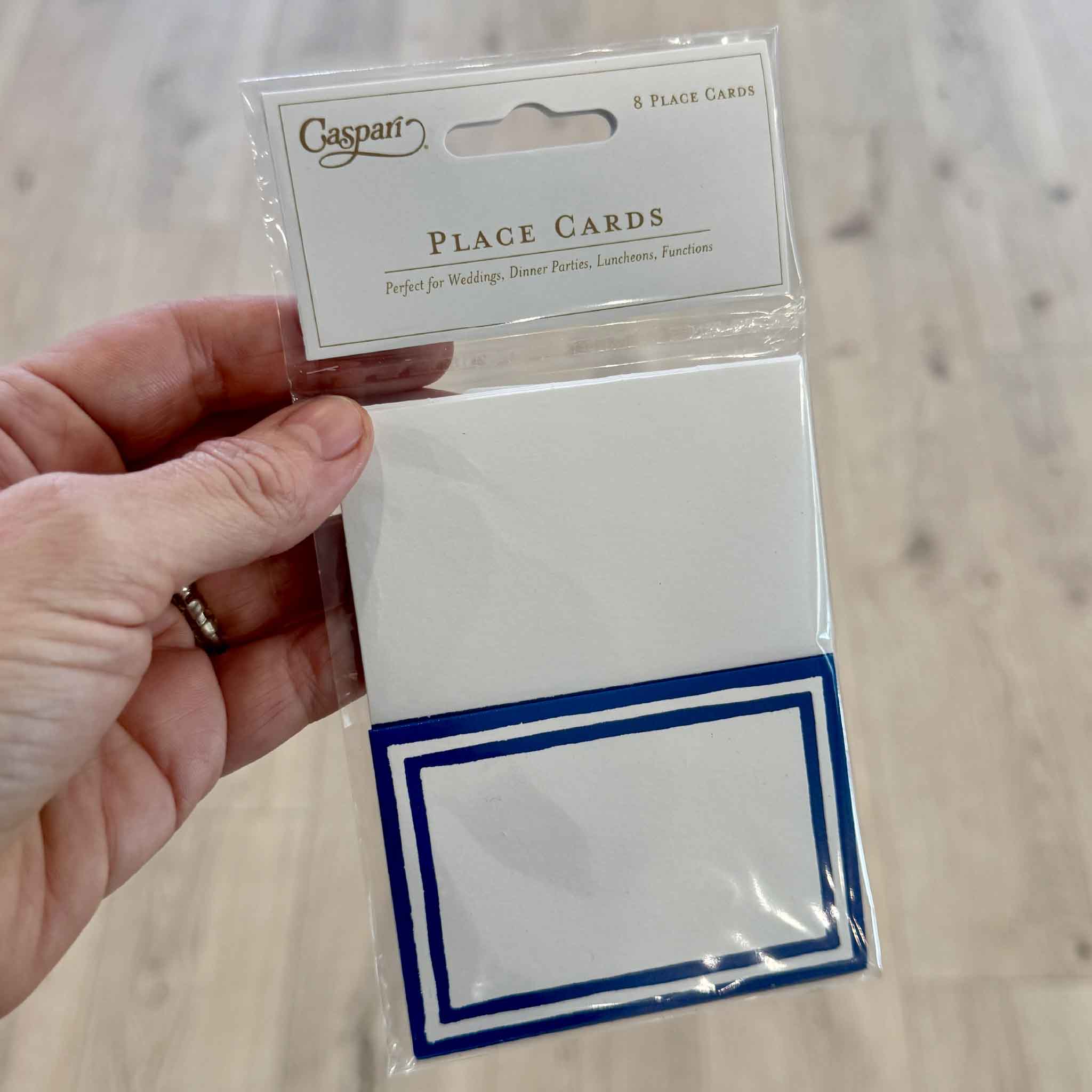 Retail package of Caspari Stripe Border Blue Place Cards containing eight premium folded place cards for weddings, luncheons, holiday entertaining, dinner parties, and special occasions. Printed in the USA and available at Gray Man Gallery in Pawleys Island, South Carolina.