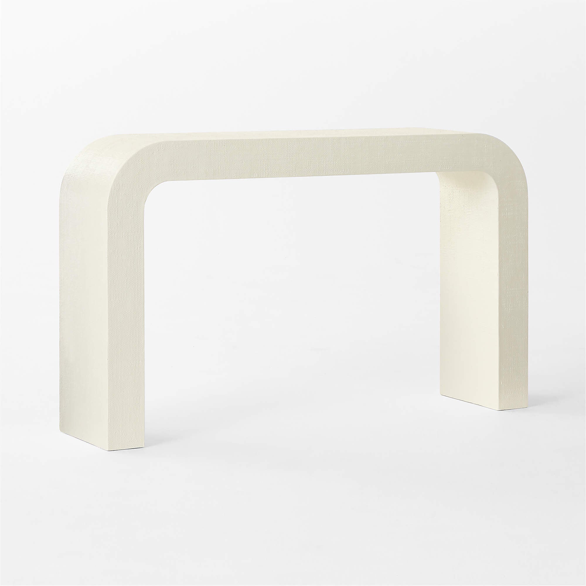 CB2 Crescent 52 inch ivory resin console table featuring sculptural rounded waterfall silhouette and textured raffia inspired finish, pre owned designer console available at Gray Man Gallery Pawleys Island South Carolina