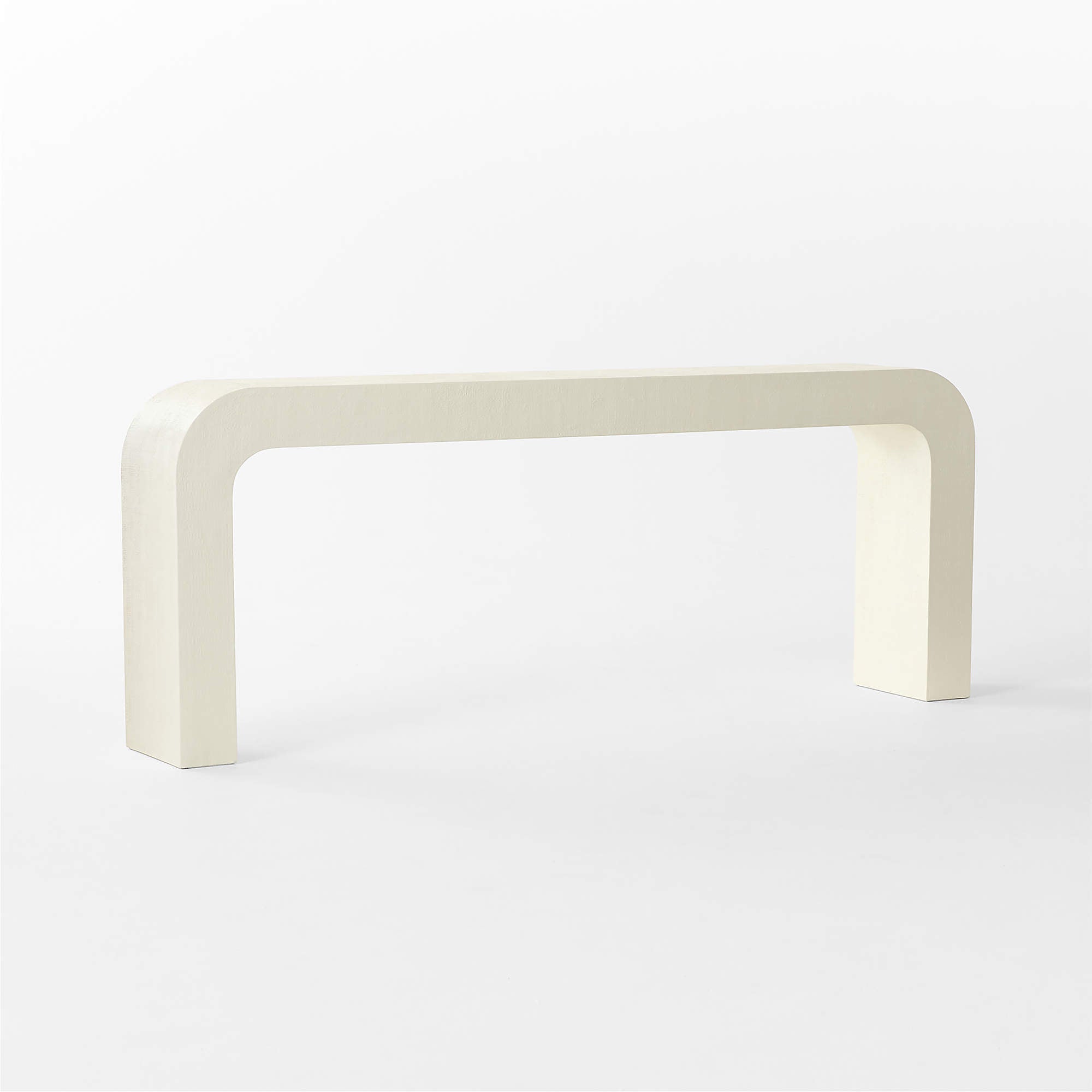 CB2 Crescent 80 inch ivory resin console table with softly rounded waterfall form and hand textured resin surface, modern designer console table pre owned gallery display piece at Gray Man Gallery Pawleys Island
