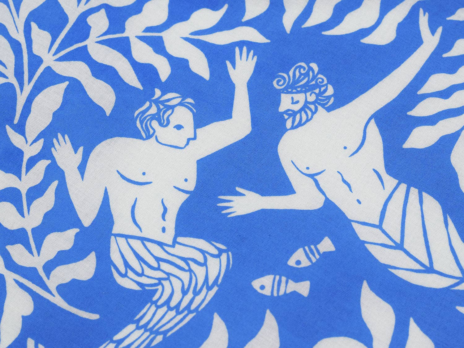 Detailed view of the Cerulean Mermaid organic cotton bandana highlighting intricate underwater artwork with mermaids, seaweed, and marine life printed on soft GOTS-certified organic cotton, available at Gray Man Gallery in Pawleys Island.