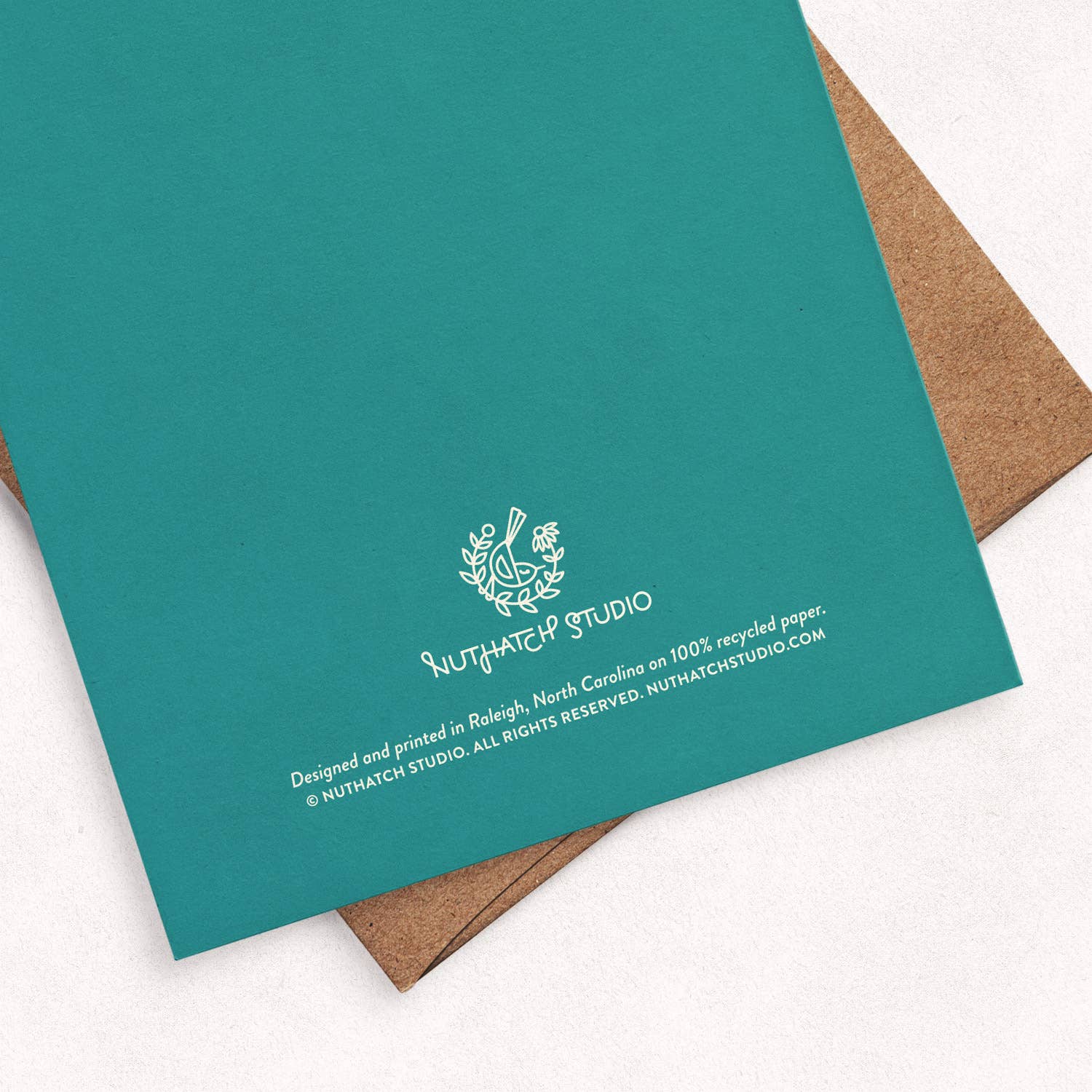 Back of the Molly Meadows greeting card by Chrissie Van Hoever showing Nuthatch Studio branding and recycled kraft envelope. This sustainably printed eco-friendly greeting card is available at Gray Man Gallery in Pawleys Island, South Carolina.