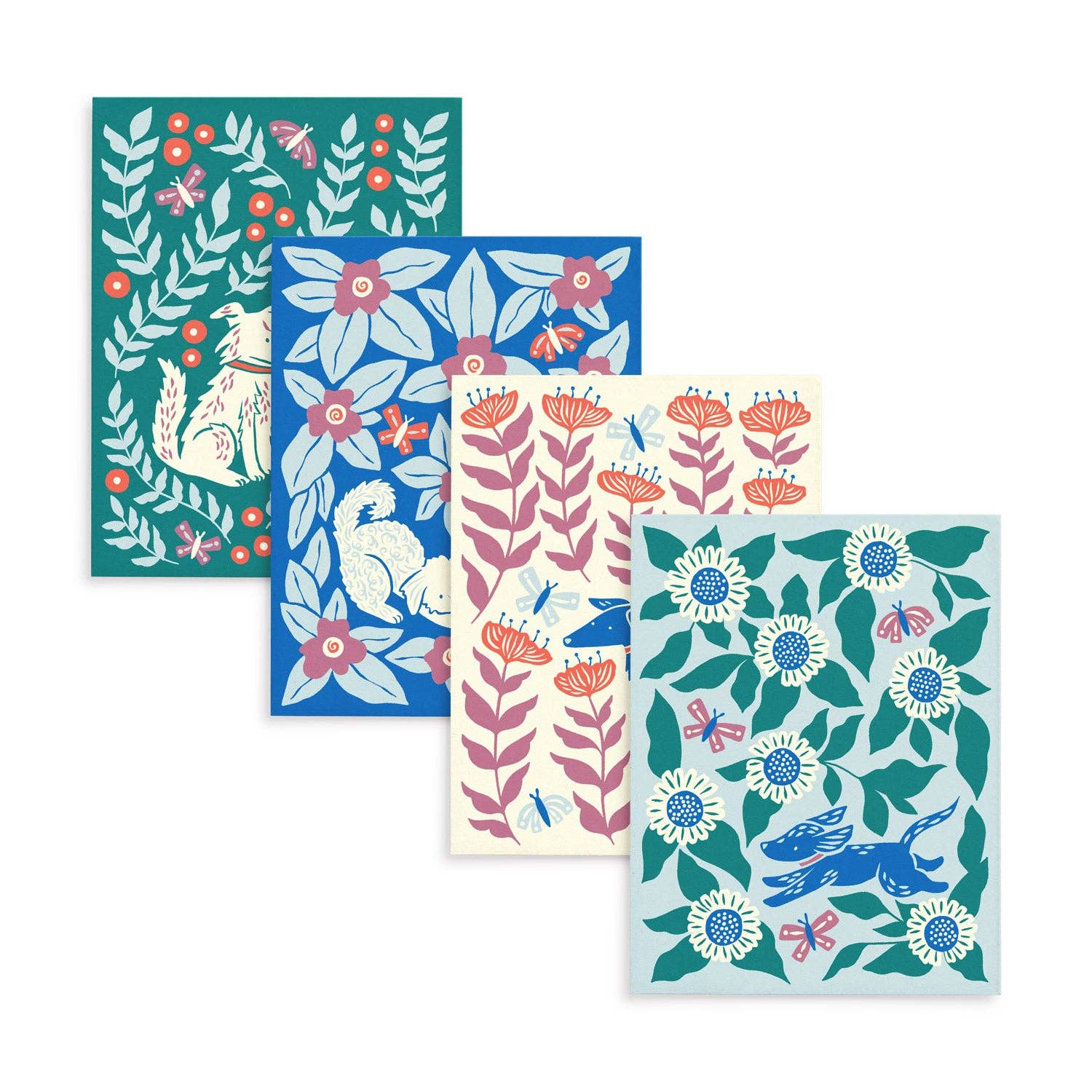 Four original Dogs & Blooms greeting card designs by Chrissie Van Hoever fanned together to showcase the assorted boxed set available at Gray Man Gallery in Pawleys Island. Each blank card features colorful folk-art inspired illustrations of playful dogs, flowers, butterflies, and botanical patterns printed on recycled paper.