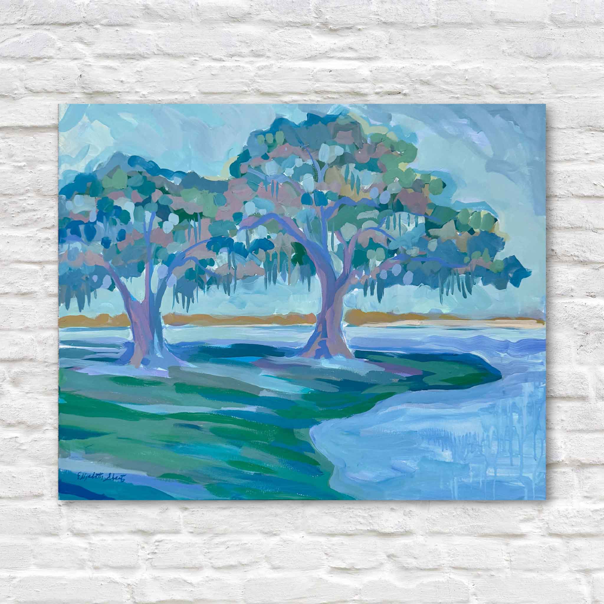 Live Oak Diptych I original acrylic painting by local artist Elizabeth Sheats at Gray Man Gallery featuring two live oak trees with Spanish moss along a coastal waterway in soft blue and green tones