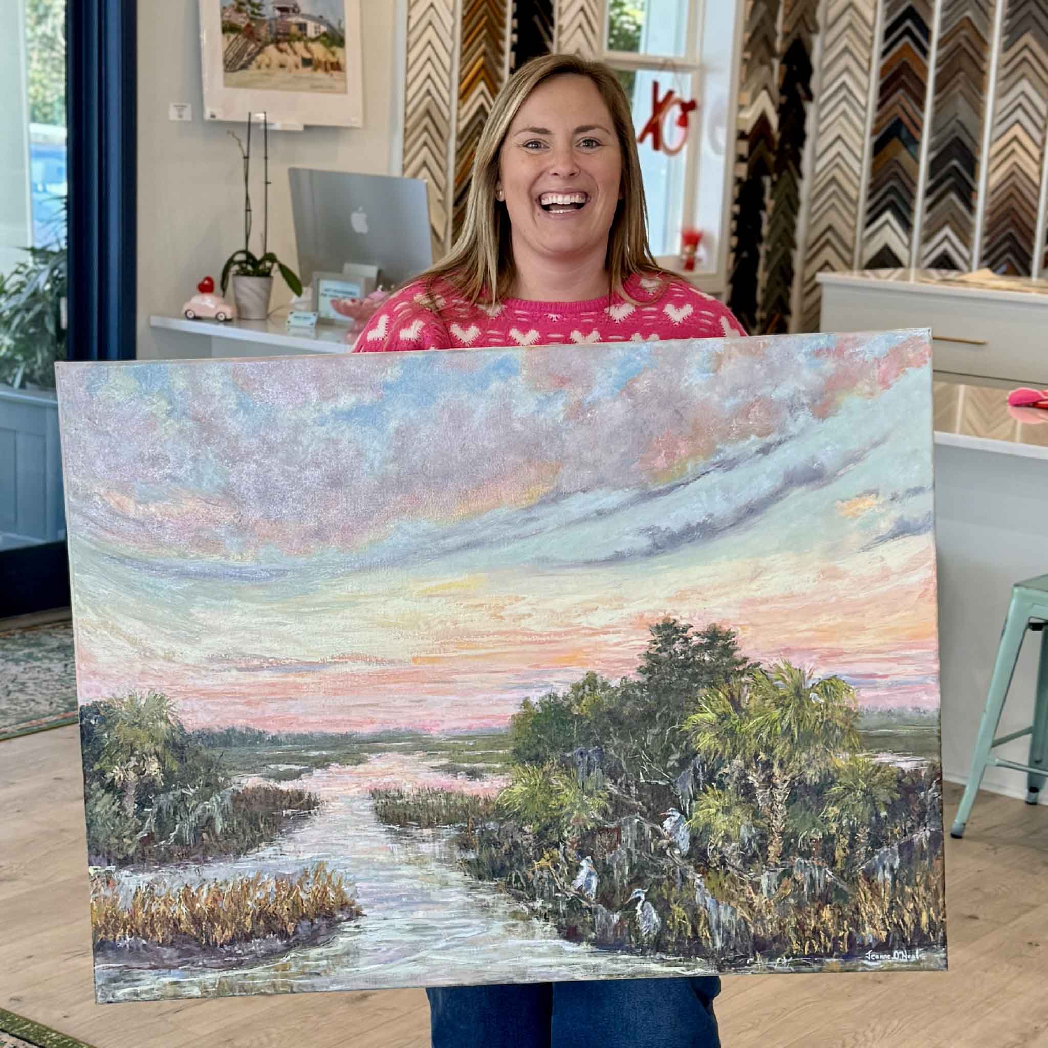 Original 40x30 oil painting “Evening Companions” by local artist Jeanne O’Neal showing a Lowcountry marsh at sunset with herons, available at Gray Man Gallery in Pawleys Island
