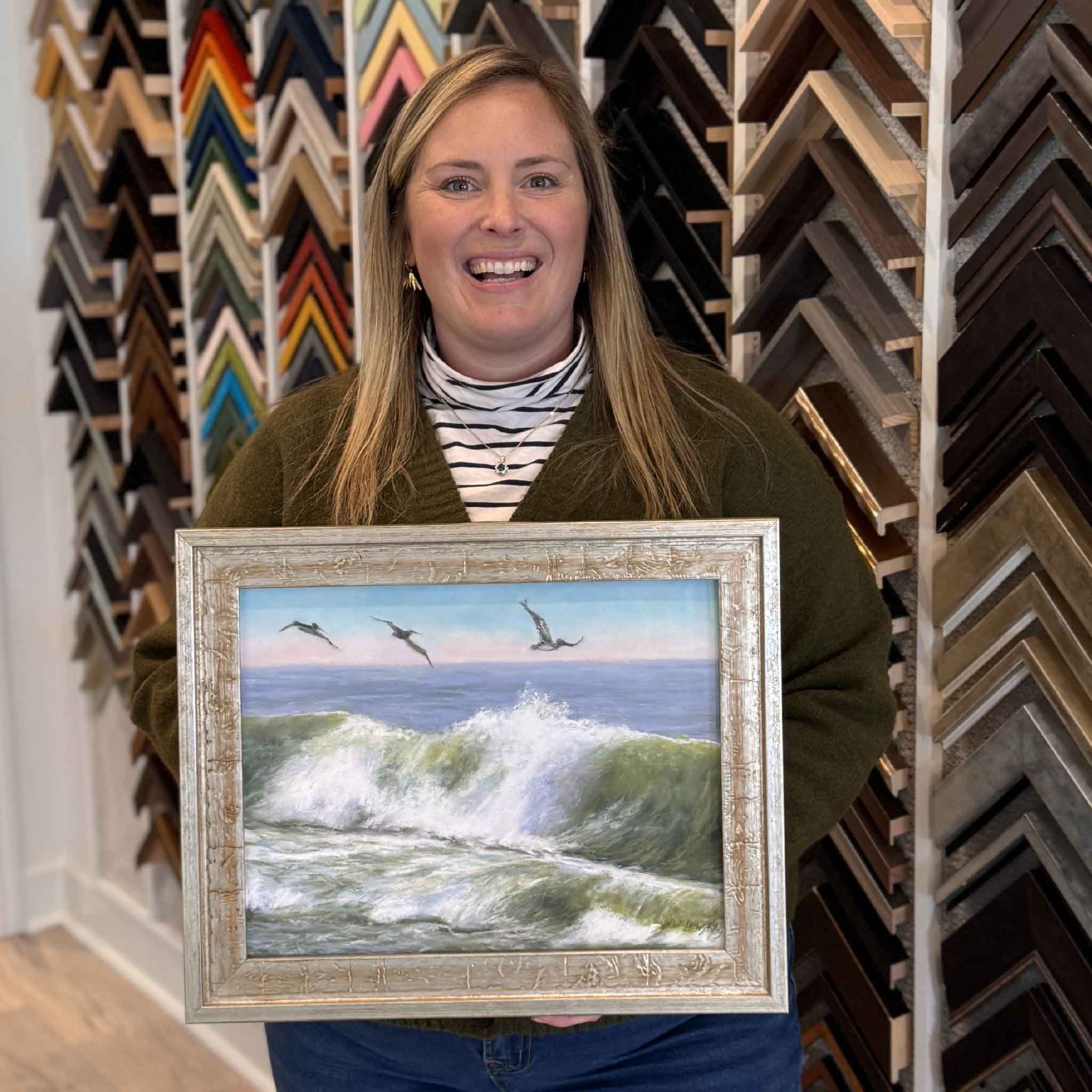 Flying High by local artist Joanne Willoughby, original pastel shown framed and held inside Gray Man Gallery in Pawleys Island, SC, photographed for scale