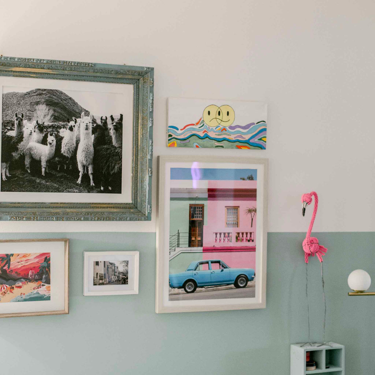 Eclectic gallery wall featuring colorful prints, photography and artwork displayed in standard-size frames, representing Gray Man Gallery’s Frame-Ready Art collection—easy-to-love art you can pop into a frame and swap out anytime—in Pawleys Island, South Carolina.