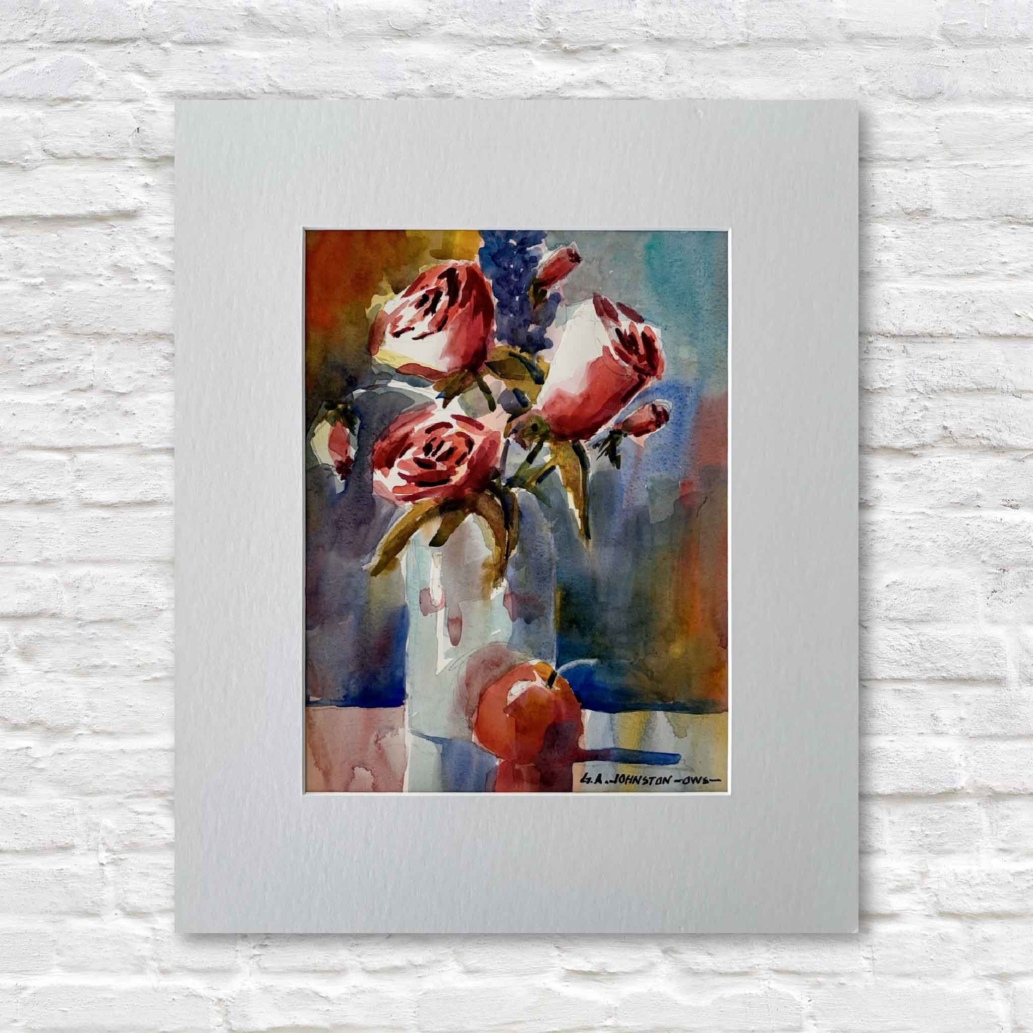 Roses by late Lowcountry watercolor artist Gary Johnston. Original watercolor featuring pink roses arranged in a white vase with a red apple below, matted and ready to frame. Available at Gray Man Gallery in Pawleys Island.