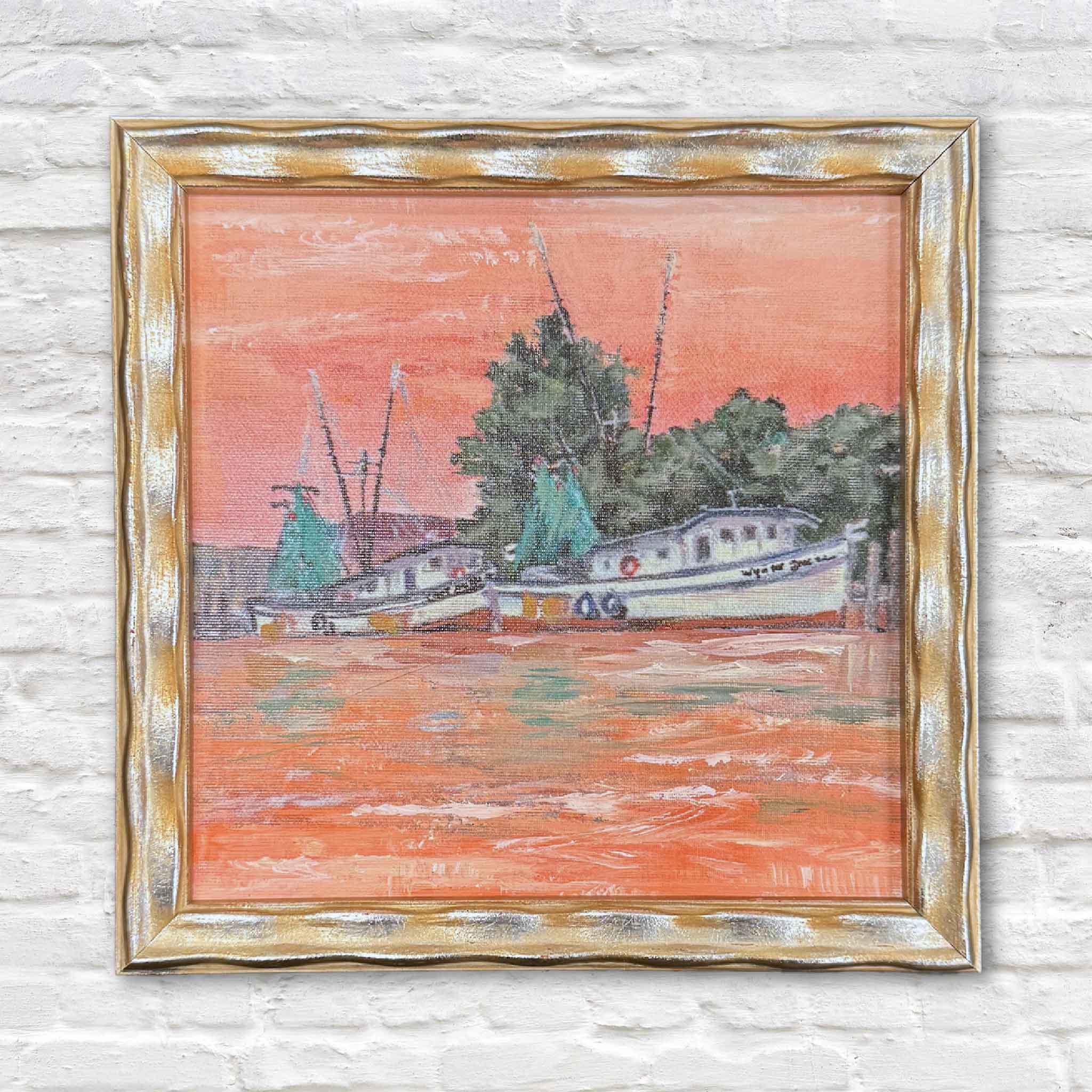 Framed fine art giclée of Harbor Reflections by Jeanne O’Neal, showing shrimp boats resting along the Georgetown harbor beneath a coral sky.