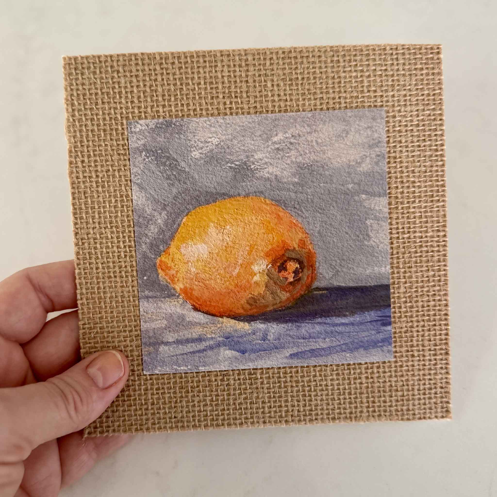 Lemon giclée print Lemon Drop by Jeanne O’Neal, 4x4 artwork mounted on 6x6 burlap matboard, fine art citrus painting available at Gray Man Gallery.