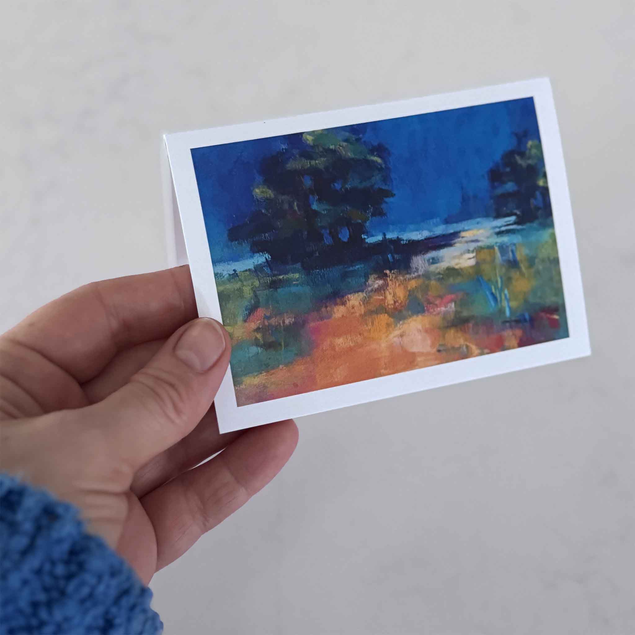 Hand holding a Lowcountry notecard by local artist Vida Miller at Gray Man Gallery, showing size and detail of the printed coastal artwork.