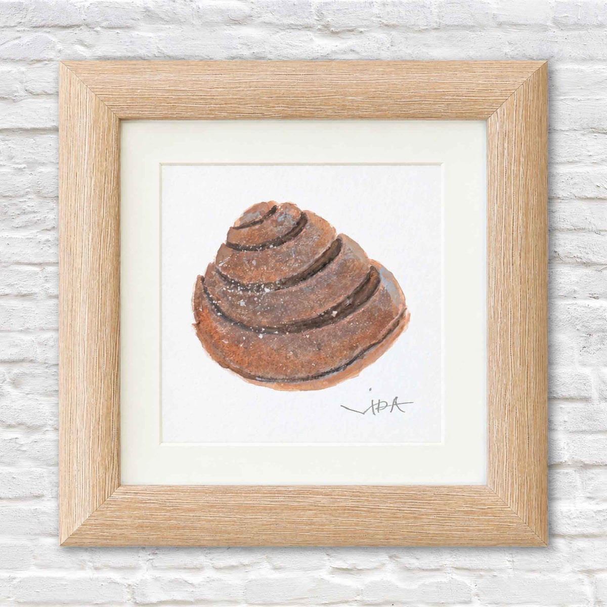 Signed original Pawleys Island shell watercolor painting by Vida Miller, featuring a warm brown coastal shell presented in a petite light natural wood shadowbox frame at Gray Man Gallery in Pawleys Island.