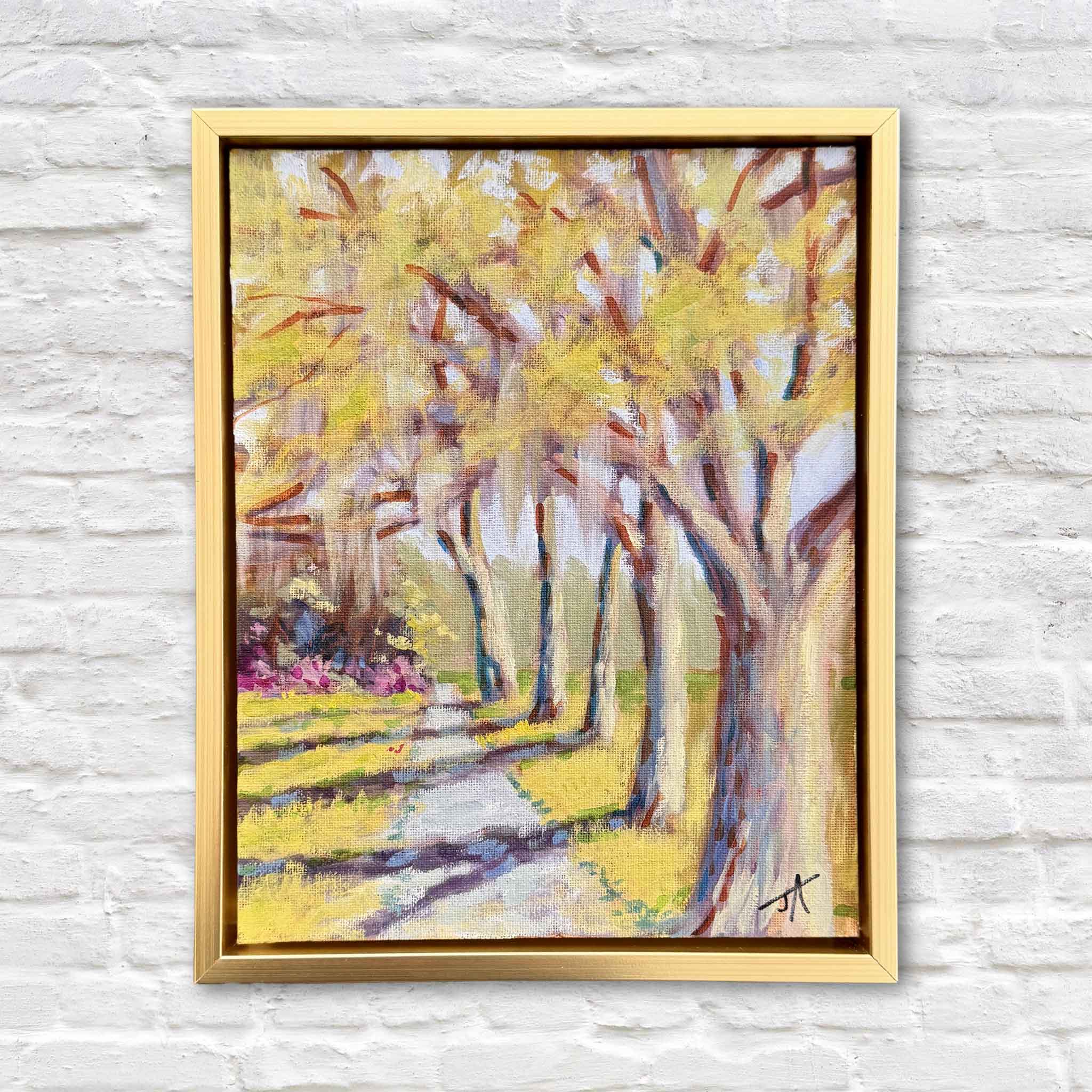 Along the Path by Jamie Arnold original oil painting created at Brookgreen Gardens featuring sunlit trees, winding path, and dappled light in a warm gold frame at Gray Man Gallery Pawleys Island