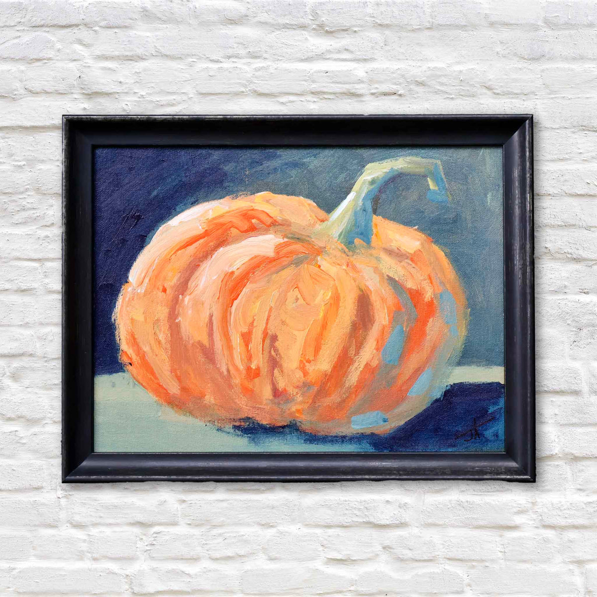 Lil’ Punkin original oil painting by local artist Jamie Arnold featuring a plump orange pumpkin with expressive brushwork against a dark background, framed and available at Gray Man Gallery in Pawleys Island, South Carolina.