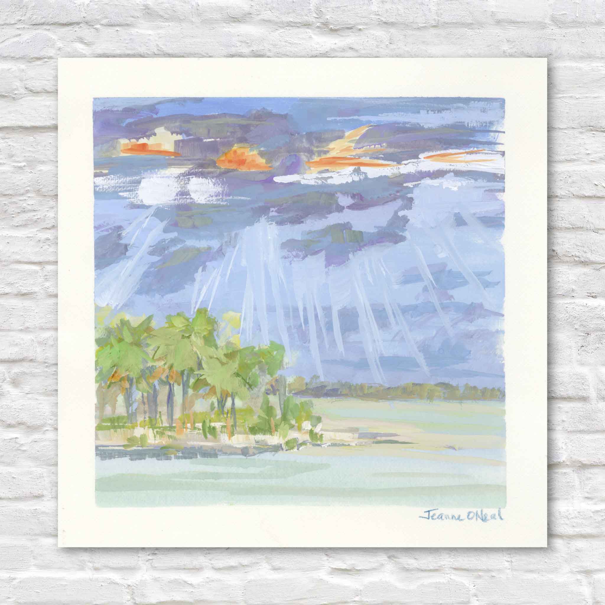 Jeanne O’Neal Breaking Light original gouache coastal landscape painting featuring dramatic sun rays breaking through dark blue clouds over pale water and a small palm-covered island from Postcards from Abaco at Gray Man Gallery Pawleys Island