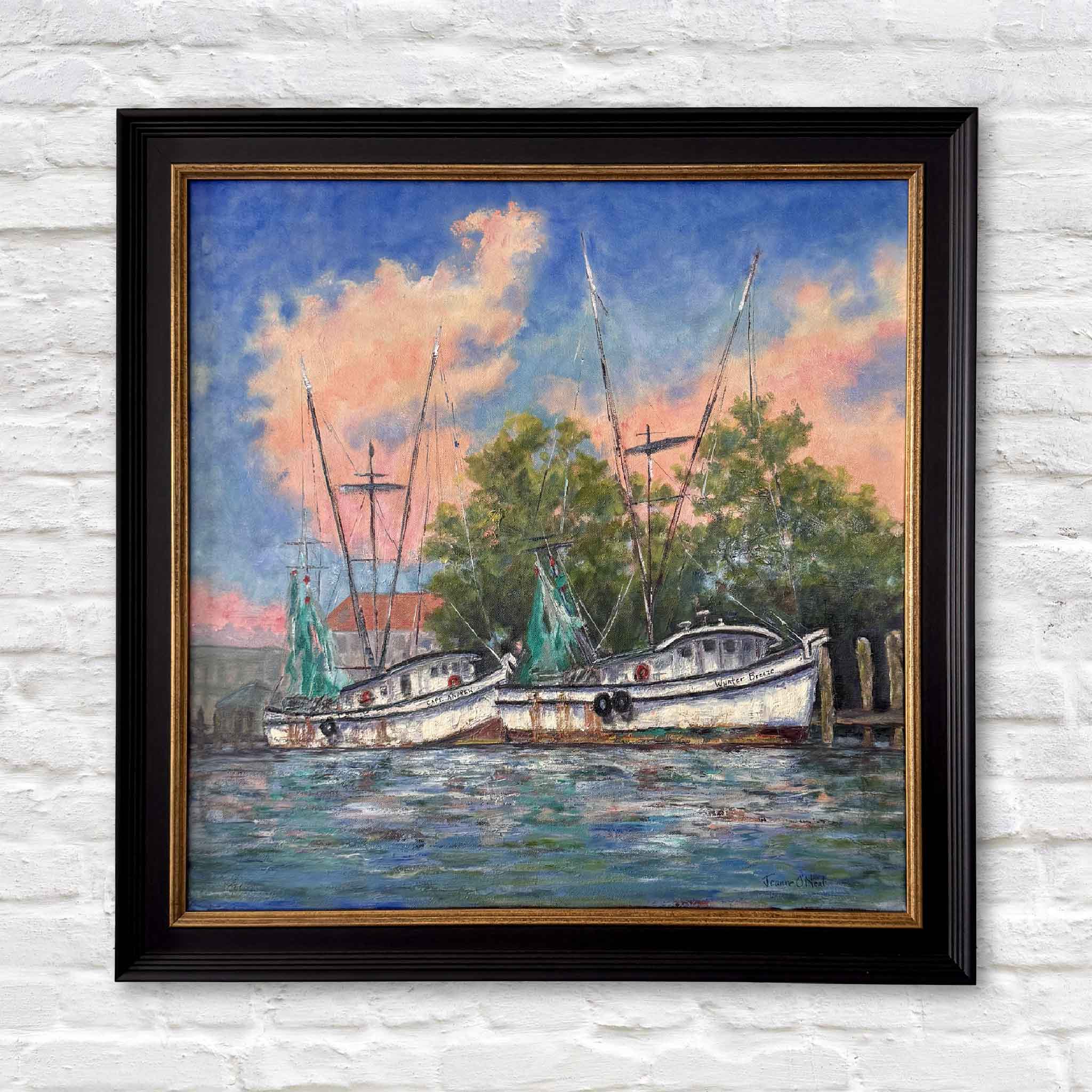 Original oil painting titled “End of Day” by Lowcountry artist Jeanne O’Neal, depicting shrimp boats returning to dock on the Georgetown South Carolina waterfront at sunset, with coral and blue skies reflected on still harbor water, professionally custom framed and presented by Gray Man Gallery in Pawleys Island as part of the By the Dock collection of coastal maritime artwork