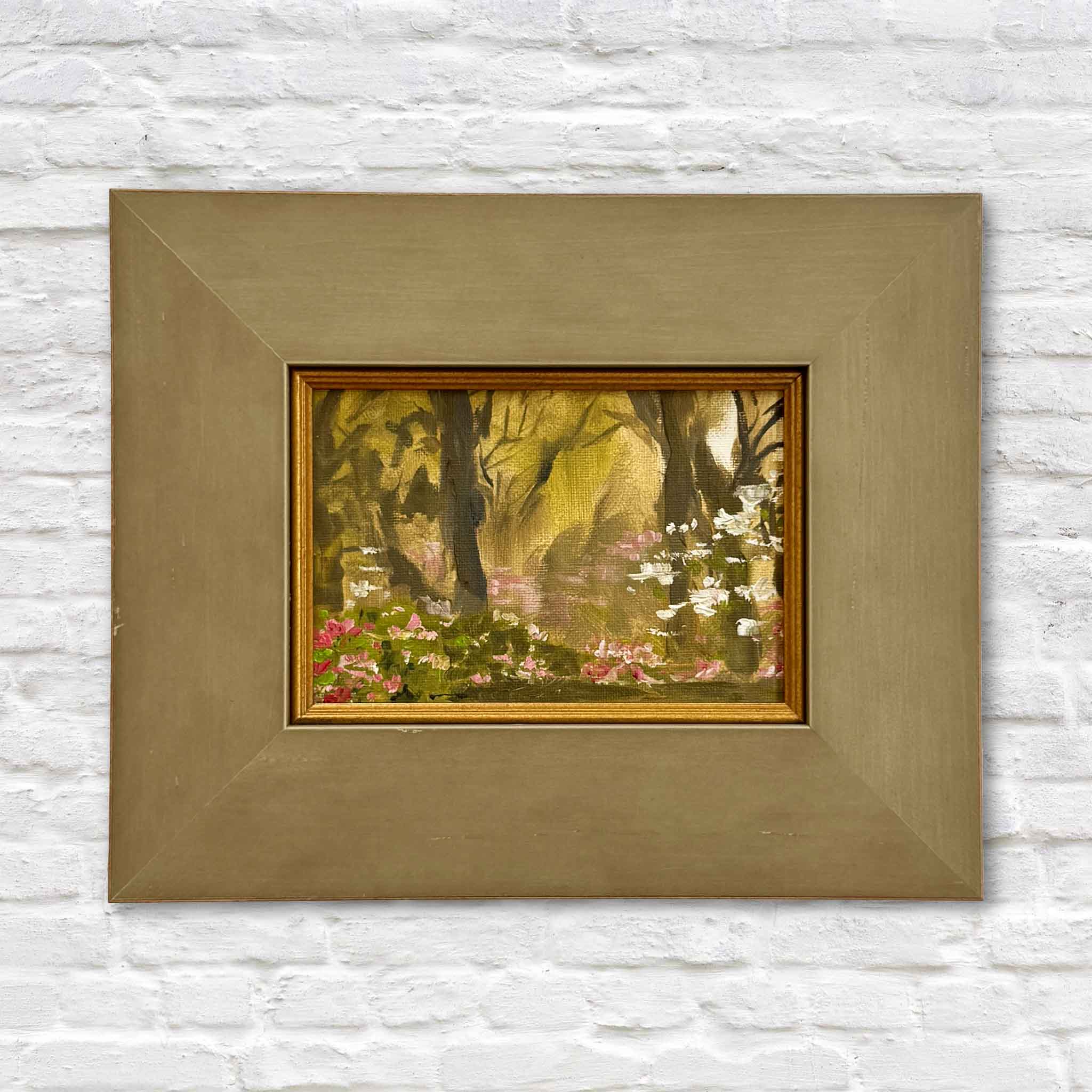 Evening Garden by Jeanne O’Neal original oil painting created at Brookgreen Gardens featuring glowing golden light through trees, pink and white florals, and lush garden landscape in custom frame at Gray Man Gallery Pawleys Island