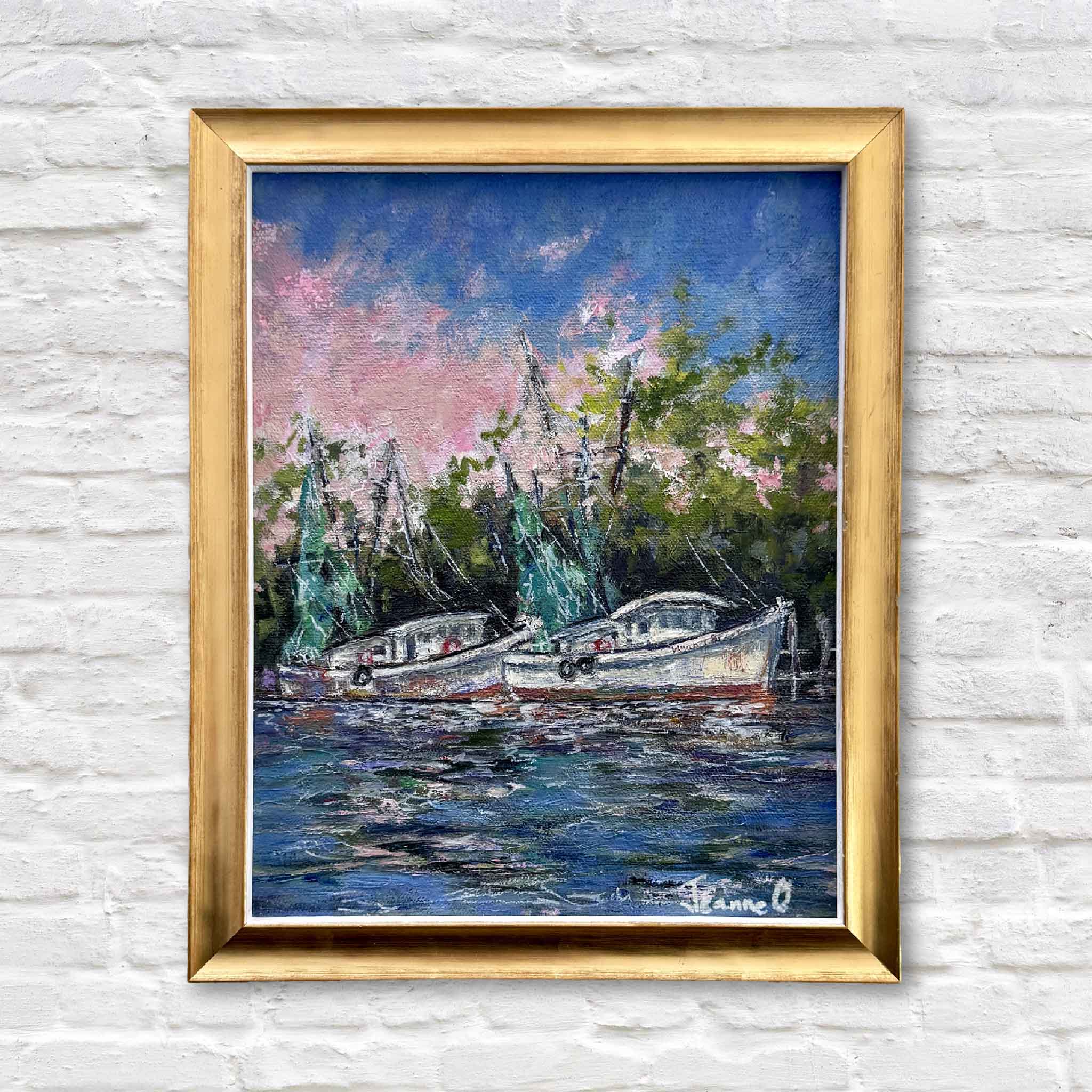 Original oil painting “Evening Light” by Jeanne O’Neal from the By the Dock collection, depicting shrimp boats at sunset on the Georgetown South Carolina waterfront with rose and blue sky reflections, professionally custom framed and presented by Gray Man Gallery in Pawleys Island as Lowcountry coastal maritime artwork