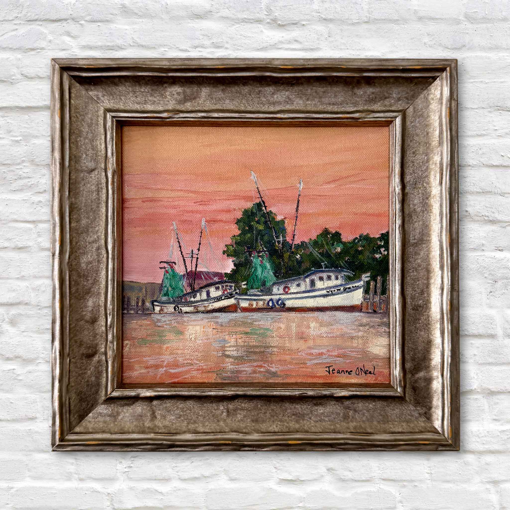 Original oil painting “Harbor Glow” by Jeanne O’Neal from the By the Dock collection, featuring shrimp boats and sunset reflections on the Georgetown South Carolina waterfront, custom framed in a luxurious Italian sculptured silver frame and presented by Gray Man Gallery in Pawleys Island as fine Lowcountry coastal artwork