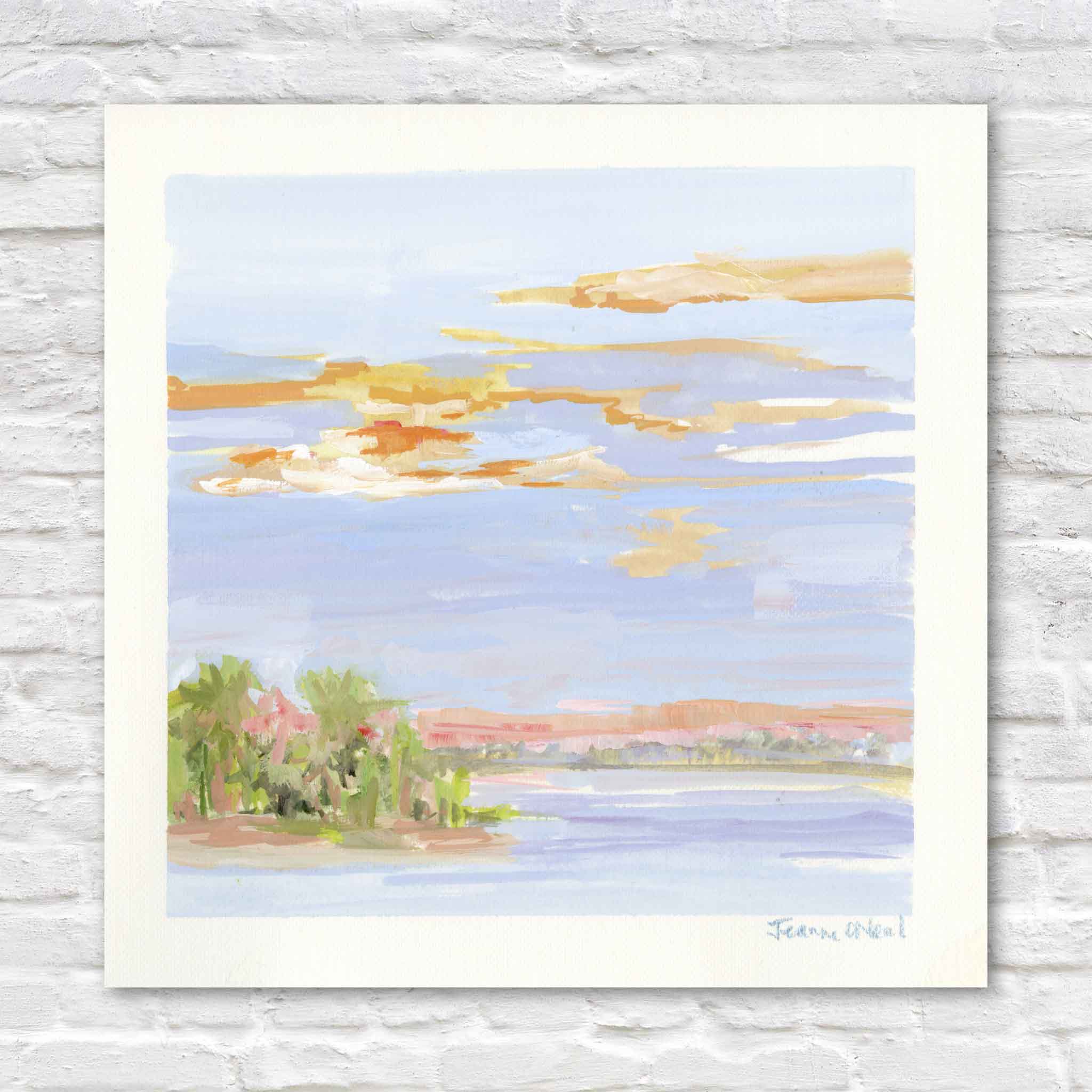 Jeanne O’Neal Last Light Over Abaco original gouache coastal landscape painting featuring a glowing sunset sky with warm peach and gold clouds over soft blue water and a small palm-covered island from Postcards from Abaco at Gray Man Gallery Pawleys Island