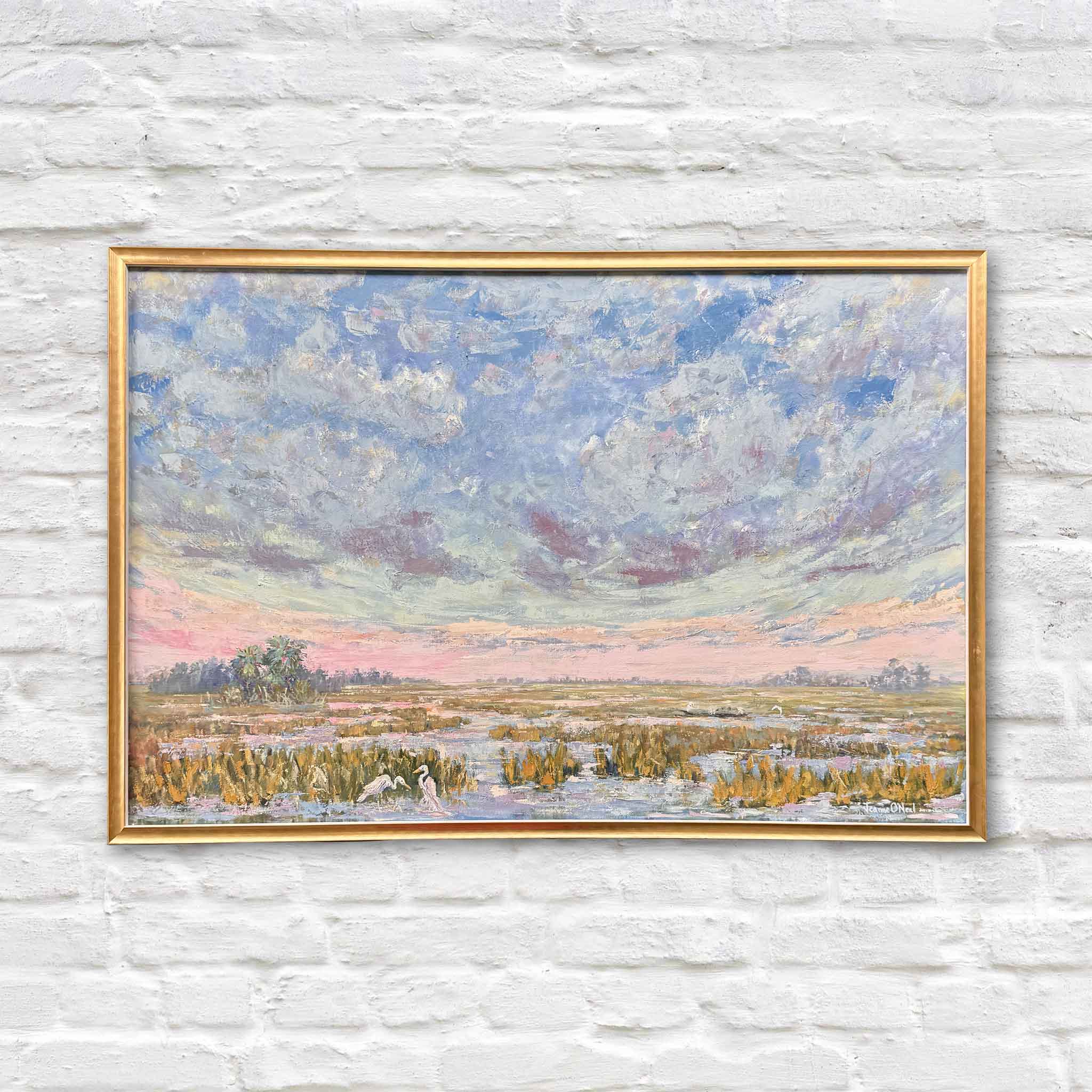 Original oil painting Pink Playground by local Lowcountry artist Jeanne O’Neal featuring expansive pastel sunset sky over coastal marsh landscape, framed in her signature warm gold frame and available at Gray Man Gallery in Pawleys Island South Carolina