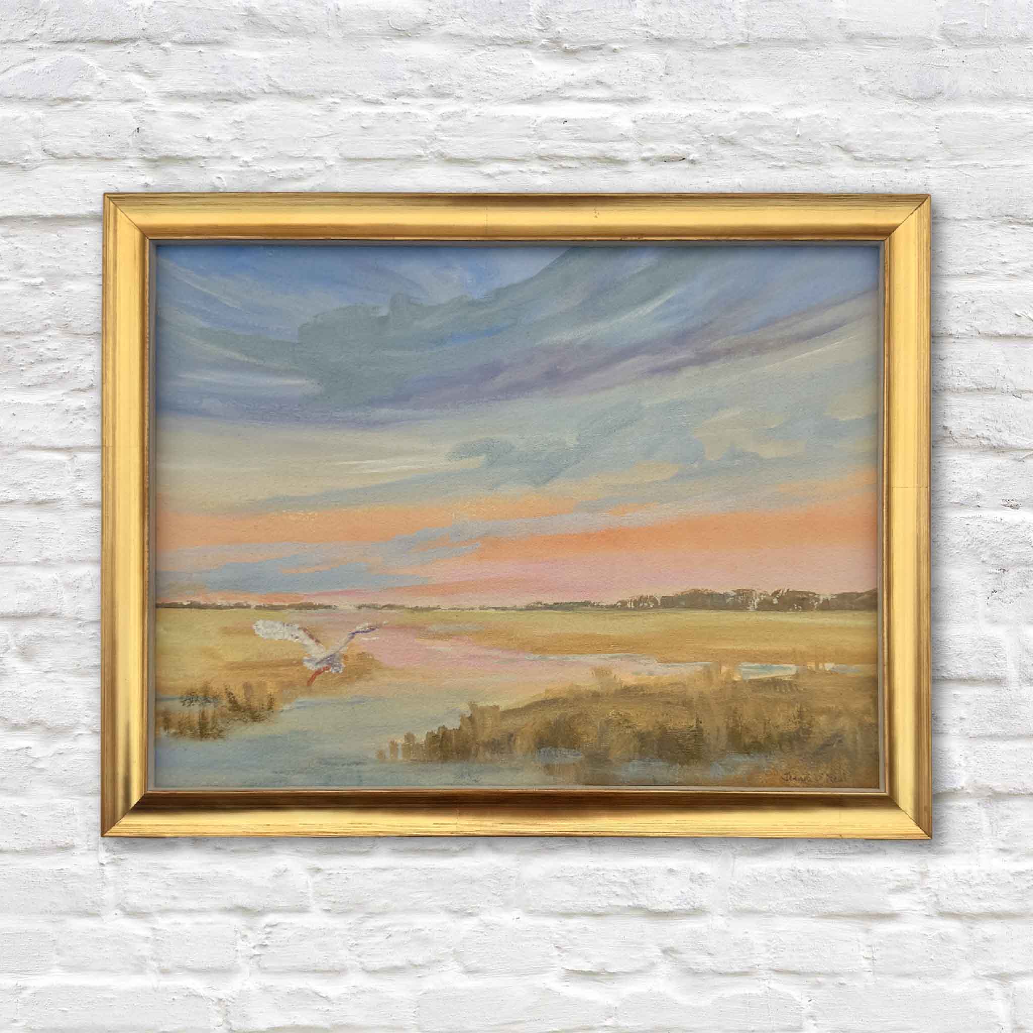 Framed oil painting ‘Slice of Heaven’ by Jeanne O’Neal featuring a colorful Lowcountry sunset over the marsh in a gold frame.