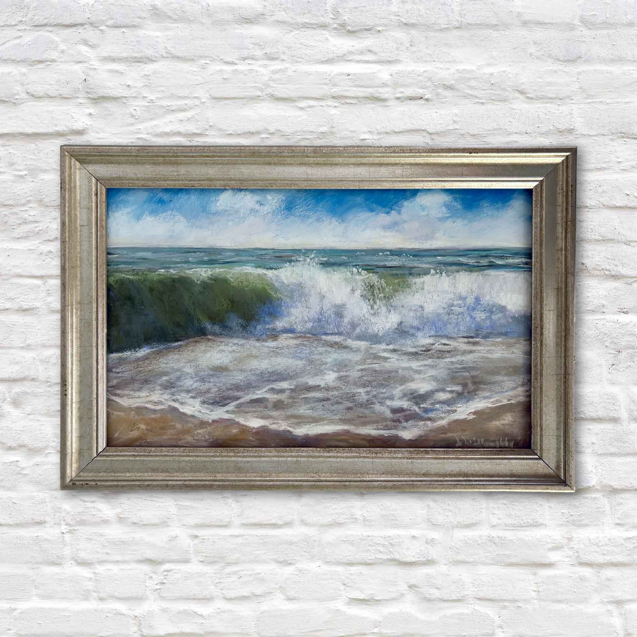 Perfect Day by local artist Joanne Willoughby, an original ocean pastel painting featuring a sunlit emerald wave breaking onto the beach beneath a bright blue sky, professionally framed with Water White glass and available at Gray Man Gallery in Pawleys Island, South Carolina.