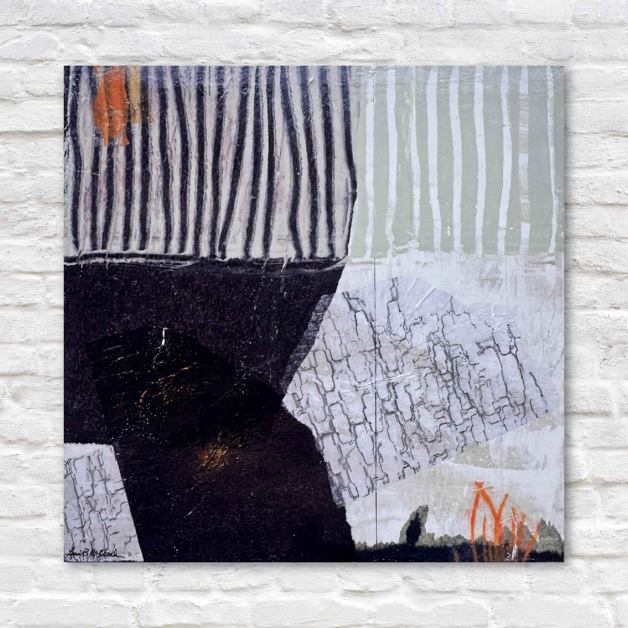 Front view of Laurie McIntosh’s mixed-media artwork ‘A Touch of Orange,’ featuring layered abstract textures, black and neutral tones, and a bright orange accent.