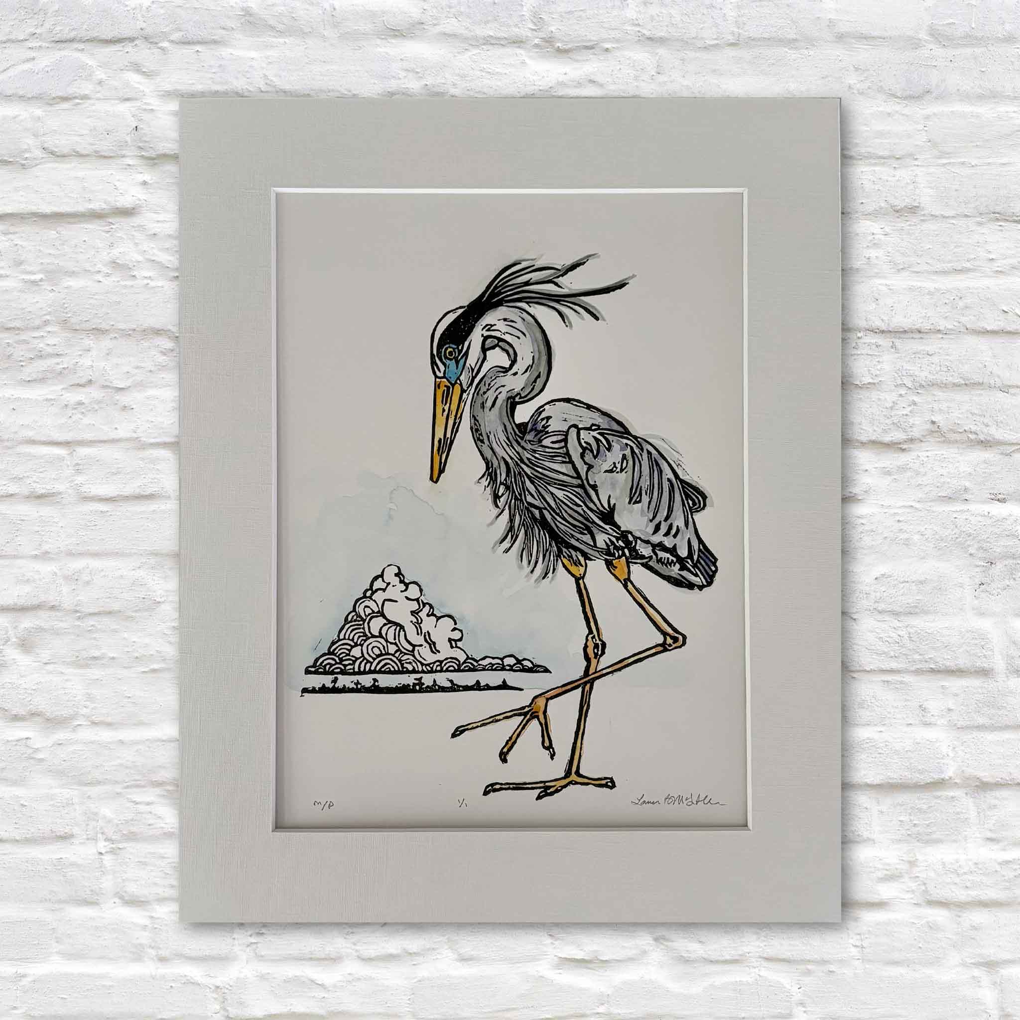 One-of-a-kind Blue Heron monoprint by Laurie McIntosh featuring a stately heron rendered with expressive black linework and hand-painted watercolor details. This original artwork is matted to a standard 11x14 size and available at Gray Man Gallery in Pawleys Island, South Carolina.