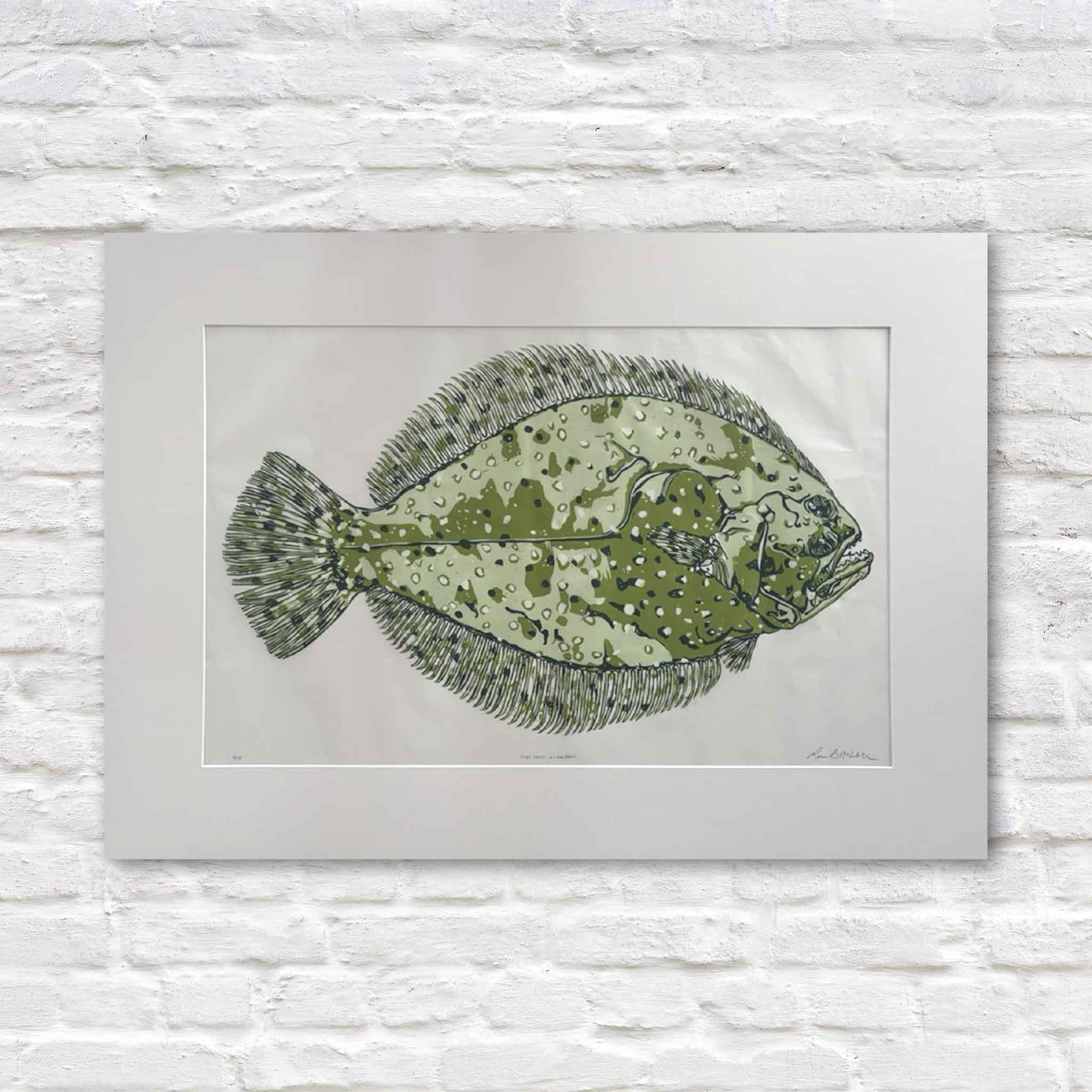 Flat Fred in Green is an original signed reduction linocut by Laurie Brownell McIntosh depicting a Lowcountry flounder in layered olive, sage, and moss green inks. This hand-pulled original artwork is professionally matted and available at Gray Man Gallery in Pawleys Island, South Carolina.