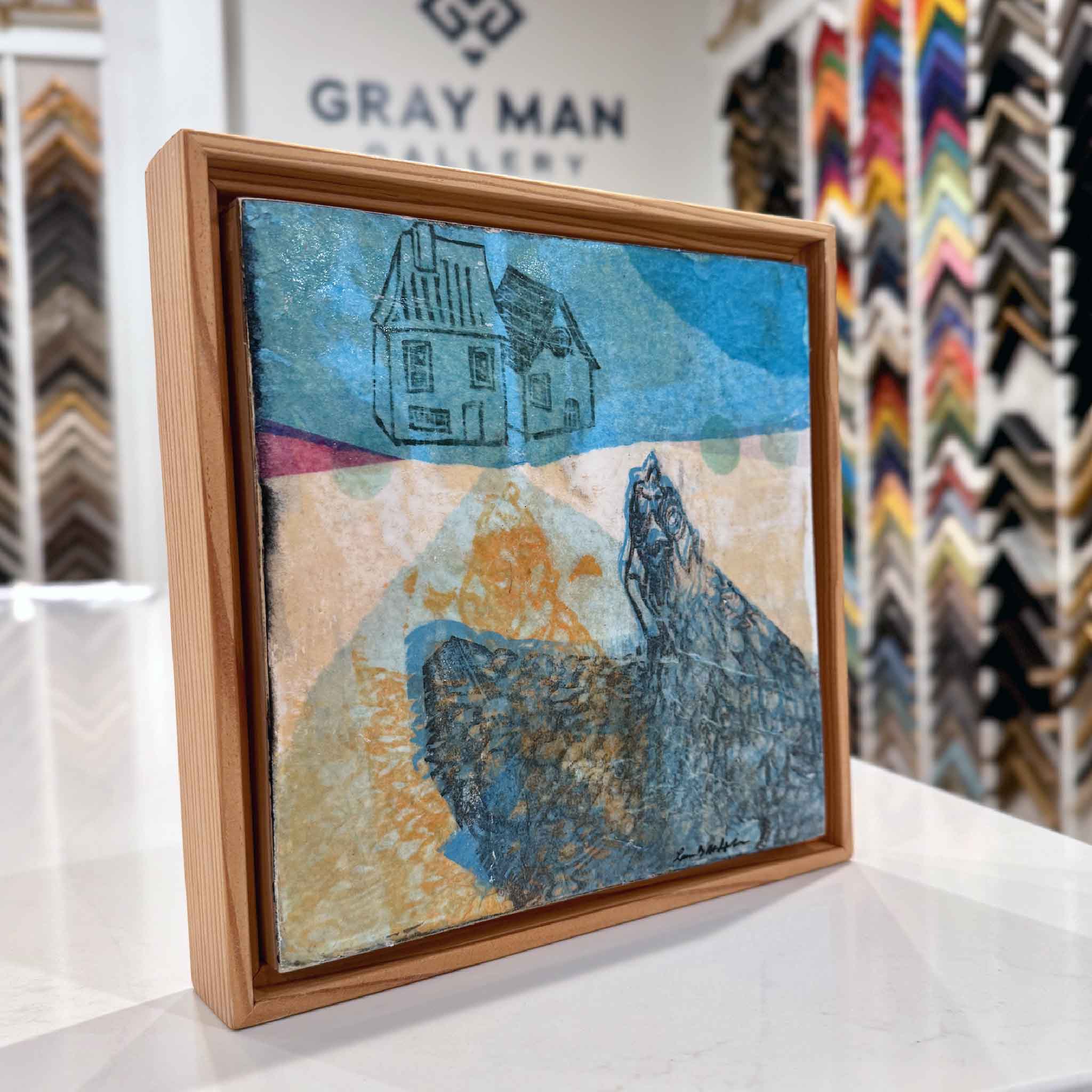 Side view of Laurie McIntosh’s “1C” mixed-media piece in a natural wood floater frame, showing surface texture and depth.