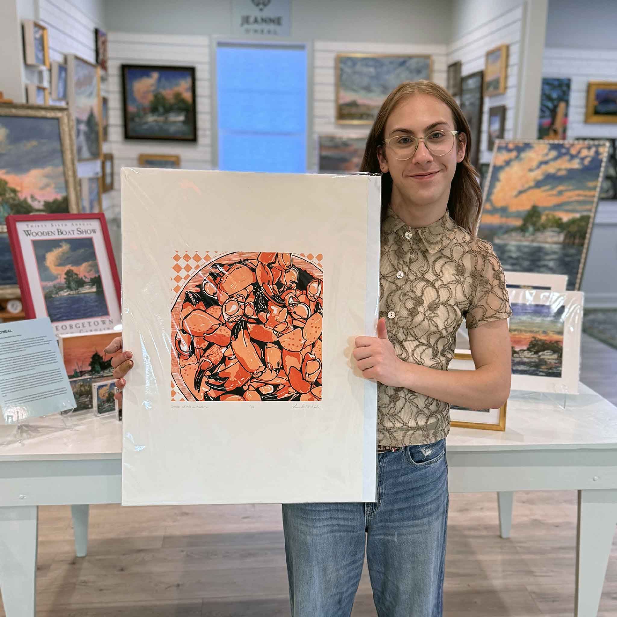 Original linocut “Stone Crab Claws” by Laurie McIntosh held at Gray Man Gallery, featuring bold orange stone crabs in a vibrant Lowcountry coastal composition.