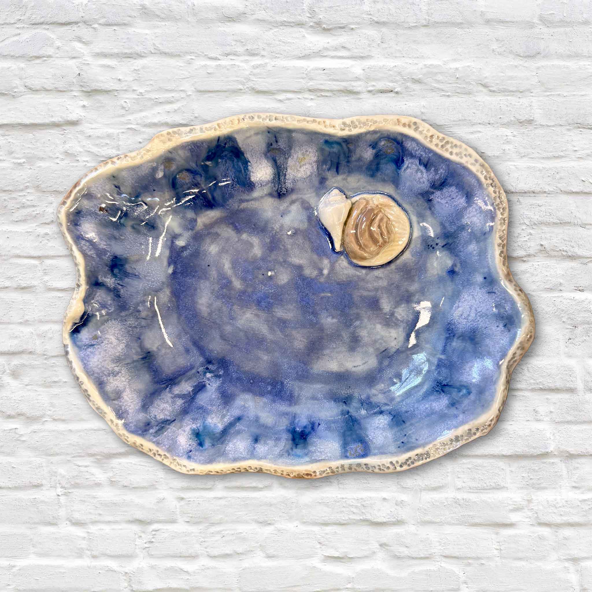 Marsh Drift Bowl Blue Shell Study by local artist Vida Miller featuring layered blue coastal glaze and subtle shell-inspired form handmade in Pawleys Island at Gray Man Gallery