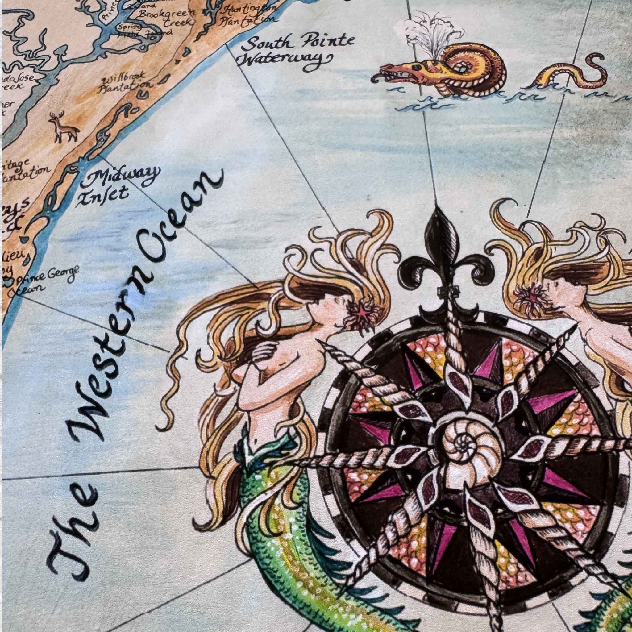 Close-up of mermaids and compass rose in April Bensch’s Mermaids & Marshlands Lowcountry map.”