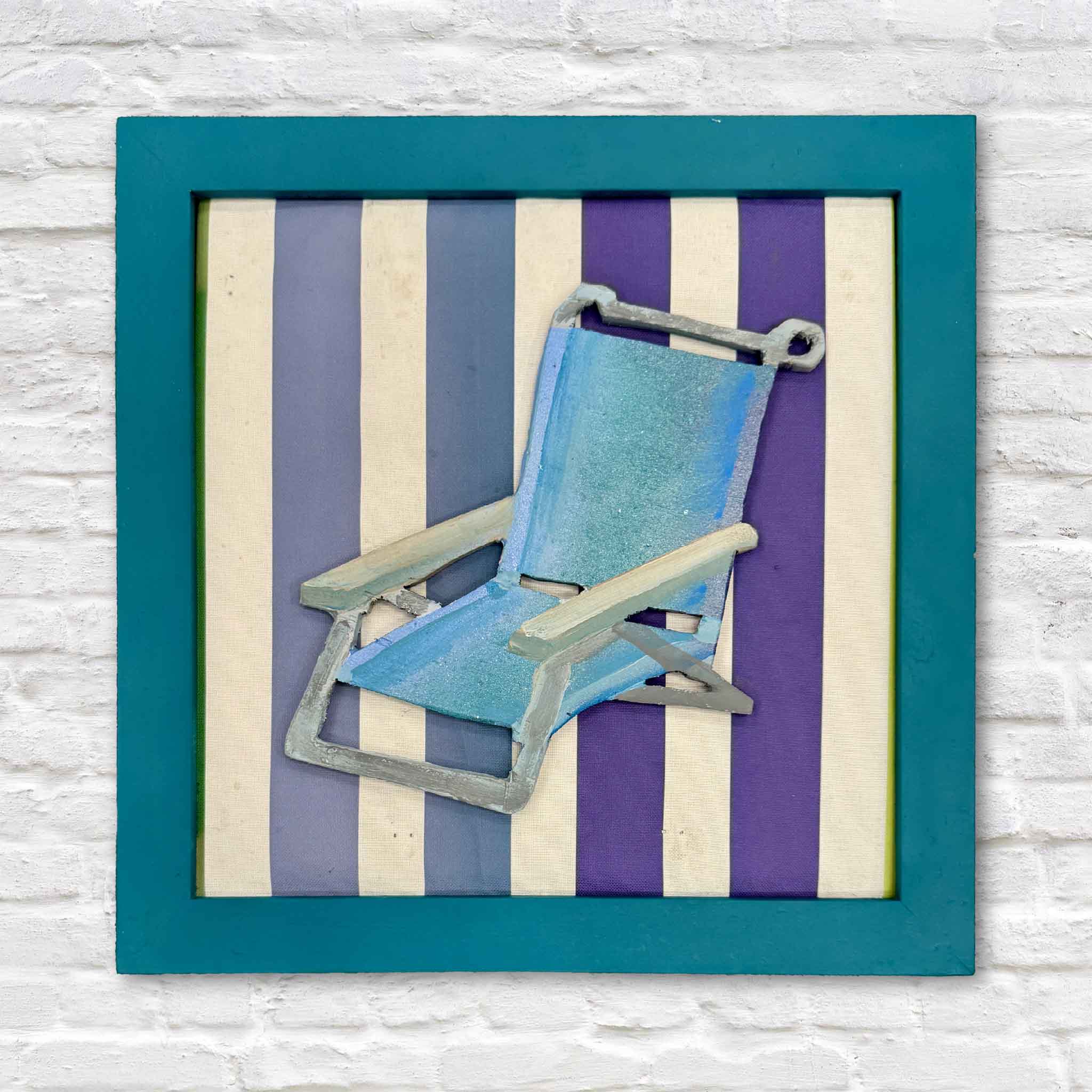 Beach Chair by Charleston artist Nick Kawczynski, a one-of-a-kind original mixed-media assemblage featuring a miniature beach chair handmade from found wood against colorful striped fabric repurposed from an old beach chair, available at Gray Man Gallery in Pawleys Island, South Carolina.