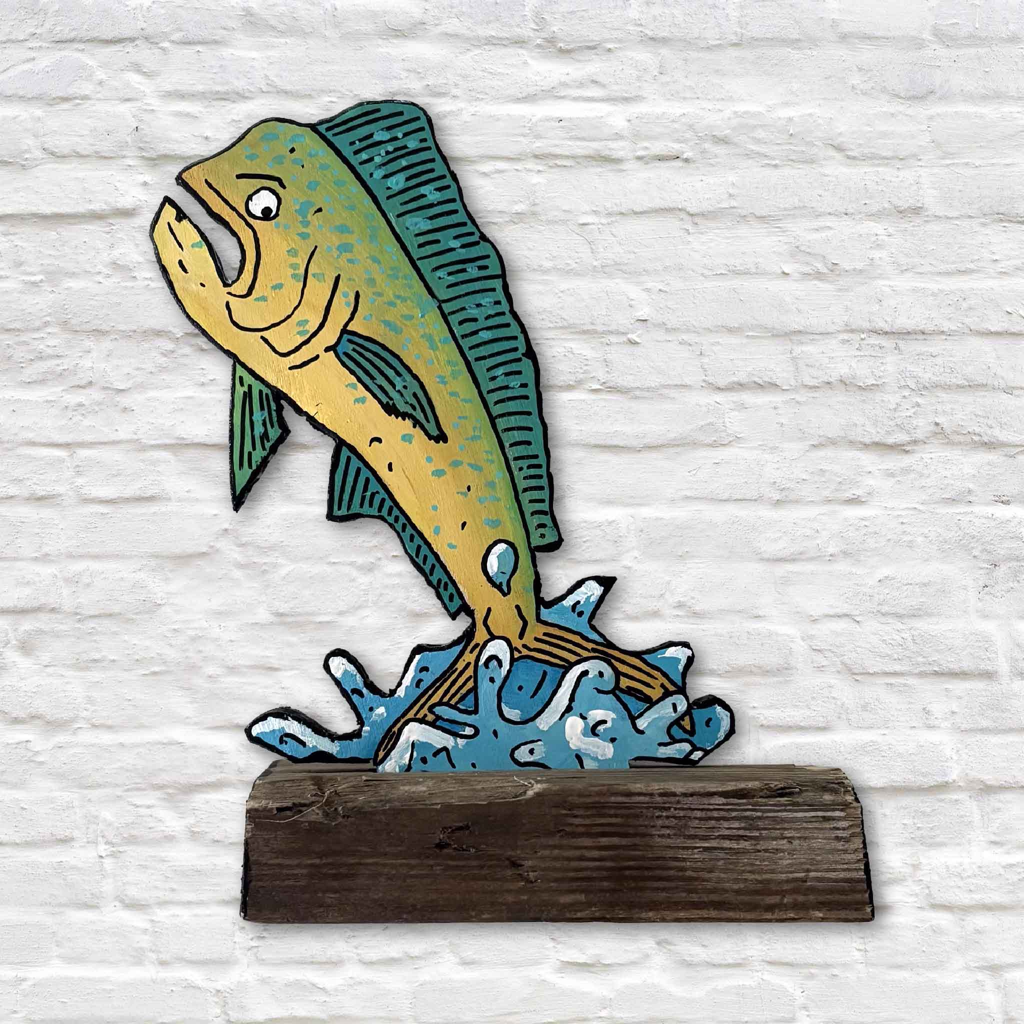Mahi Mahi Mahi Mahi by Charleston artist Nick Kawczynski, a one-of-a-kind hand-painted mixed media sculpture featuring a brightly colored mahi-mahi leaping from stylized blue waves. Created from reclaimed marine-grade plywood sourced through the Lowcountry Maritime Society boatbuilding program and mounted on a reclaimed wood base. Available exclusively at Gray Man Gallery in Pawleys Island, South Carolina.