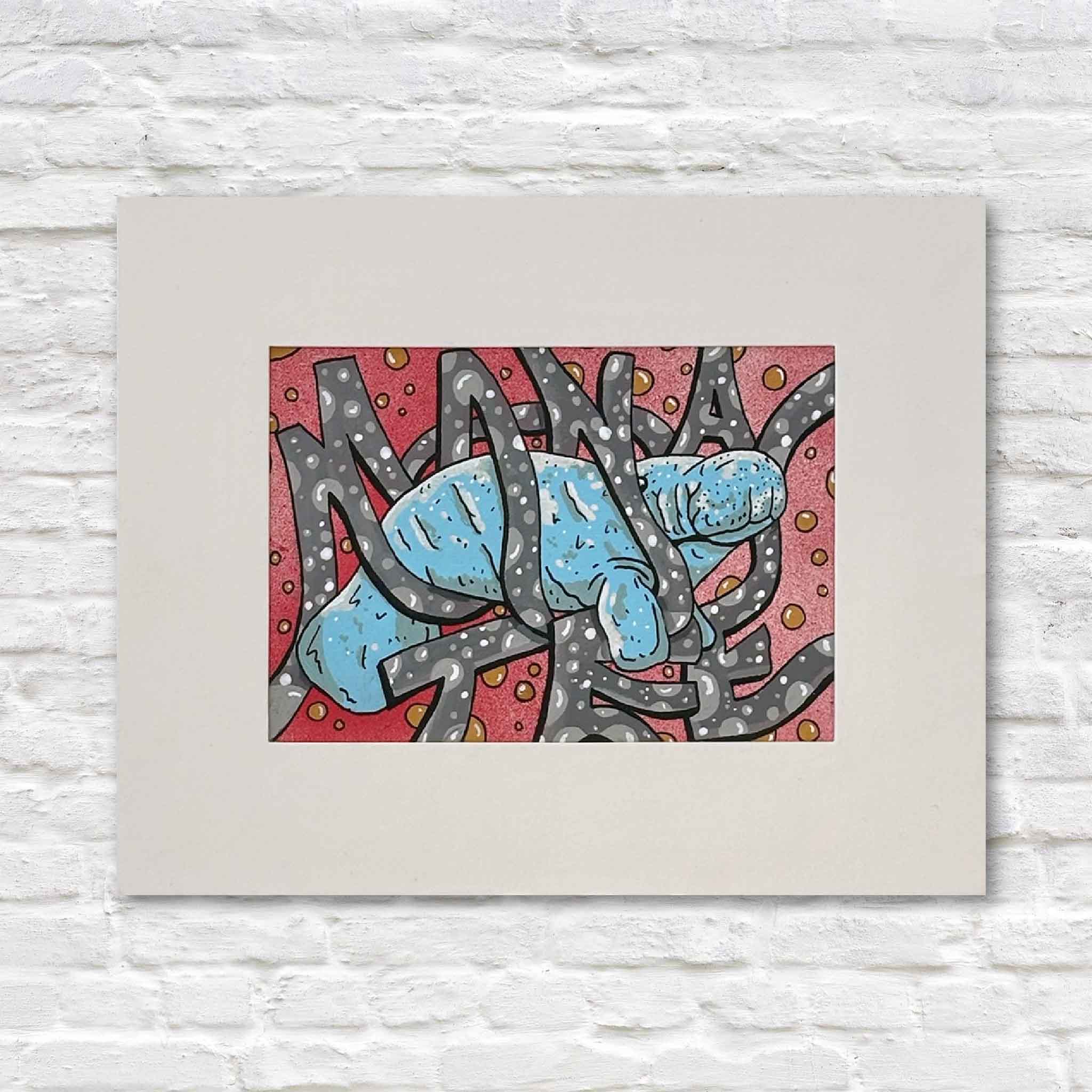 Original mixed media artwork titled Manatee by Charleston artist Nick Kawczynski featuring a bright blue manatee surrounded by hidden lettering that spells Manatee. Mixed media coastal art available at Gray Man Gallery in Pawleys Island, South Carolina.