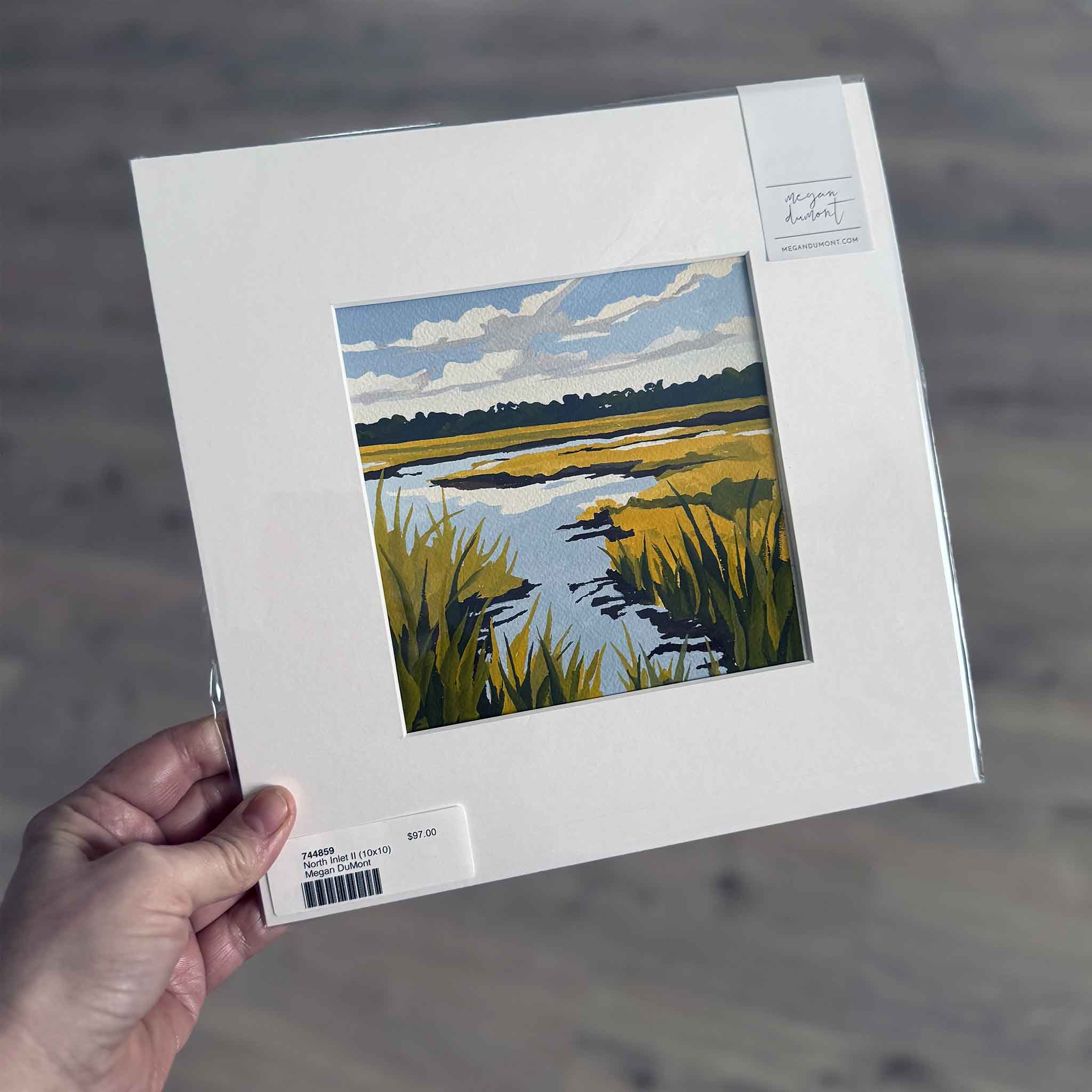 North Inlet II (10x10) gouache painting by Megan DuMont, matted coastal marsh scene with golden grasses, blue water, and cloud-filled Lowcountry sky.