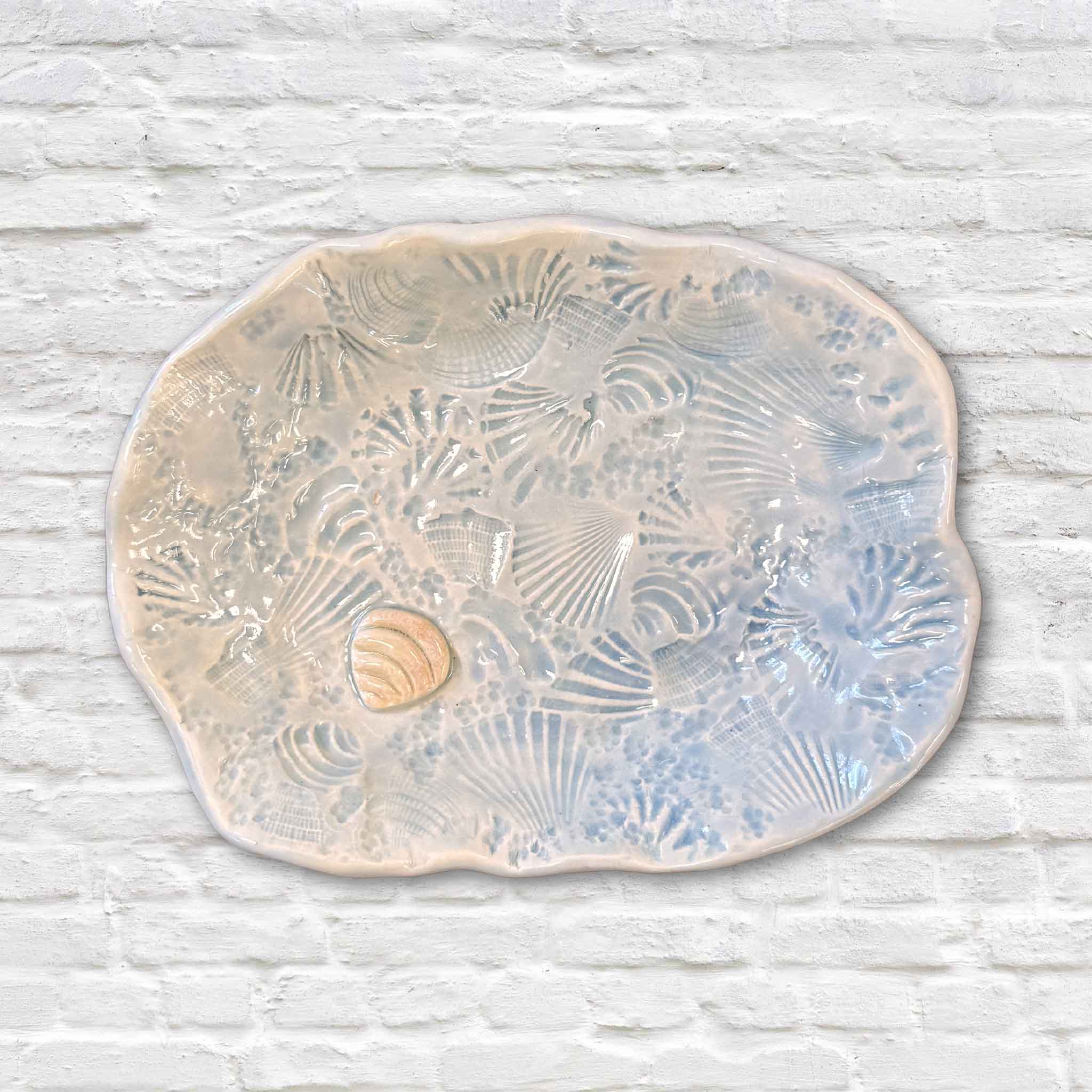 Handmade Pawleys Shore Shell Dish in Coastal Wash by local artist Vida Miller featuring hand-pressed shells from Pawleys Island and a carved shell detail at Gray Man Gallery