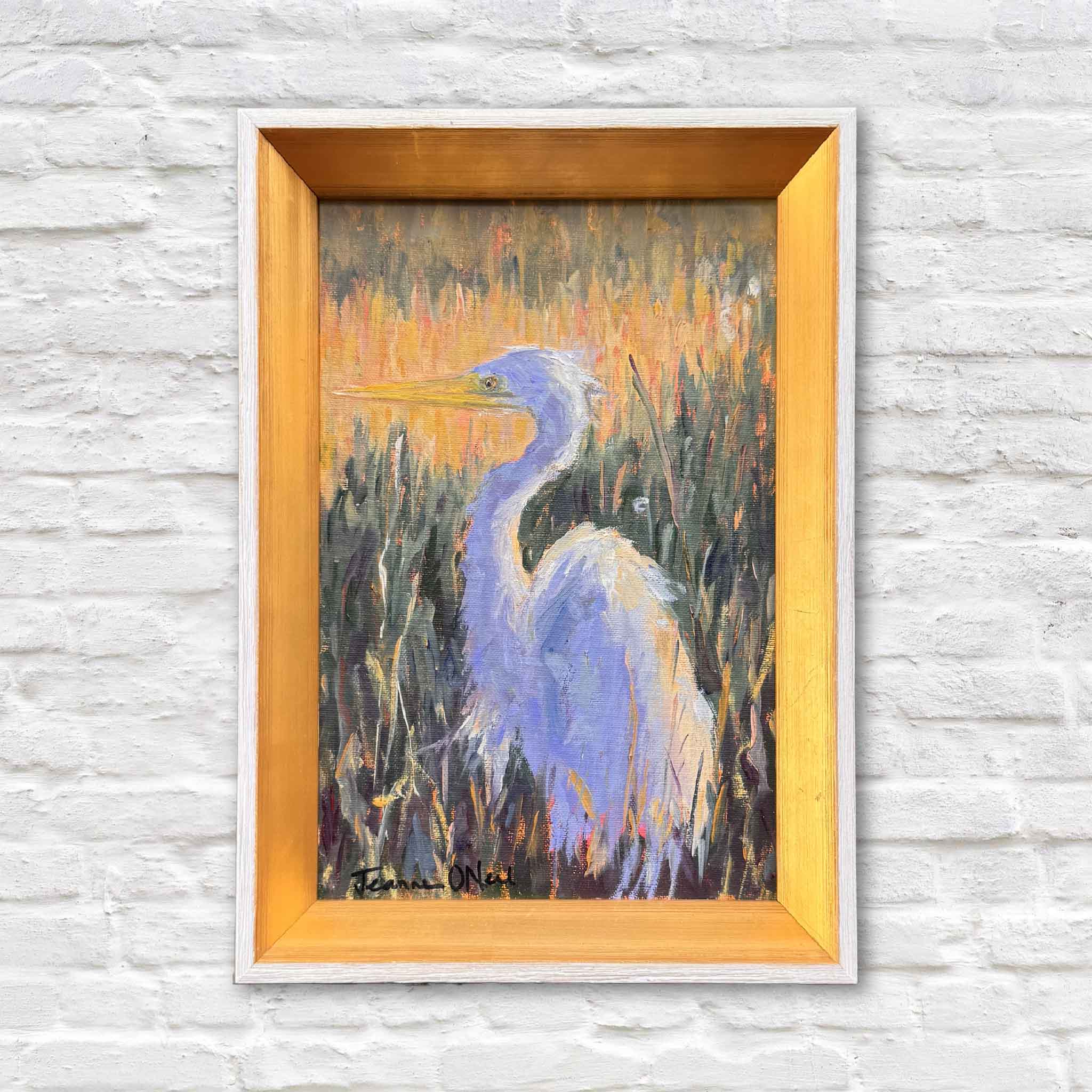Framed original oil painting “Quietly Watching” by local Lowcountry artist Jeanne O’Neal, 6x9 egret in coastal marsh grasses, displayed at Gray Man Gallery in Pawleys Island, South Carolina