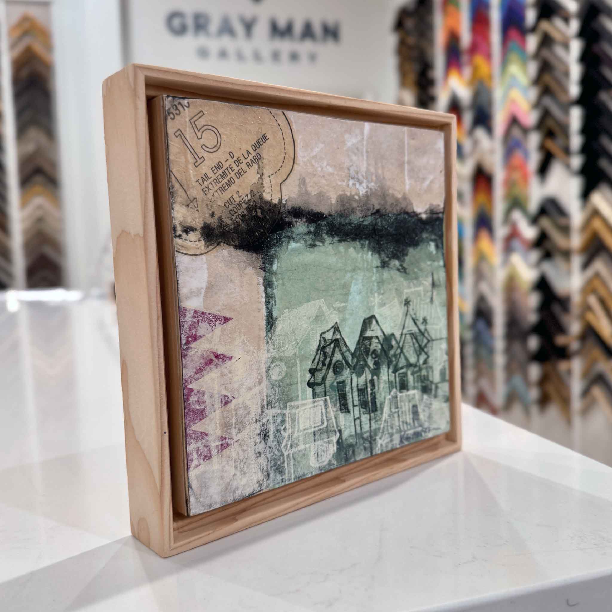 Side view of 6A by Laurie McIntosh showing the mixed-media surface and rustic wood floater frame in the Gray Man Gallery space.