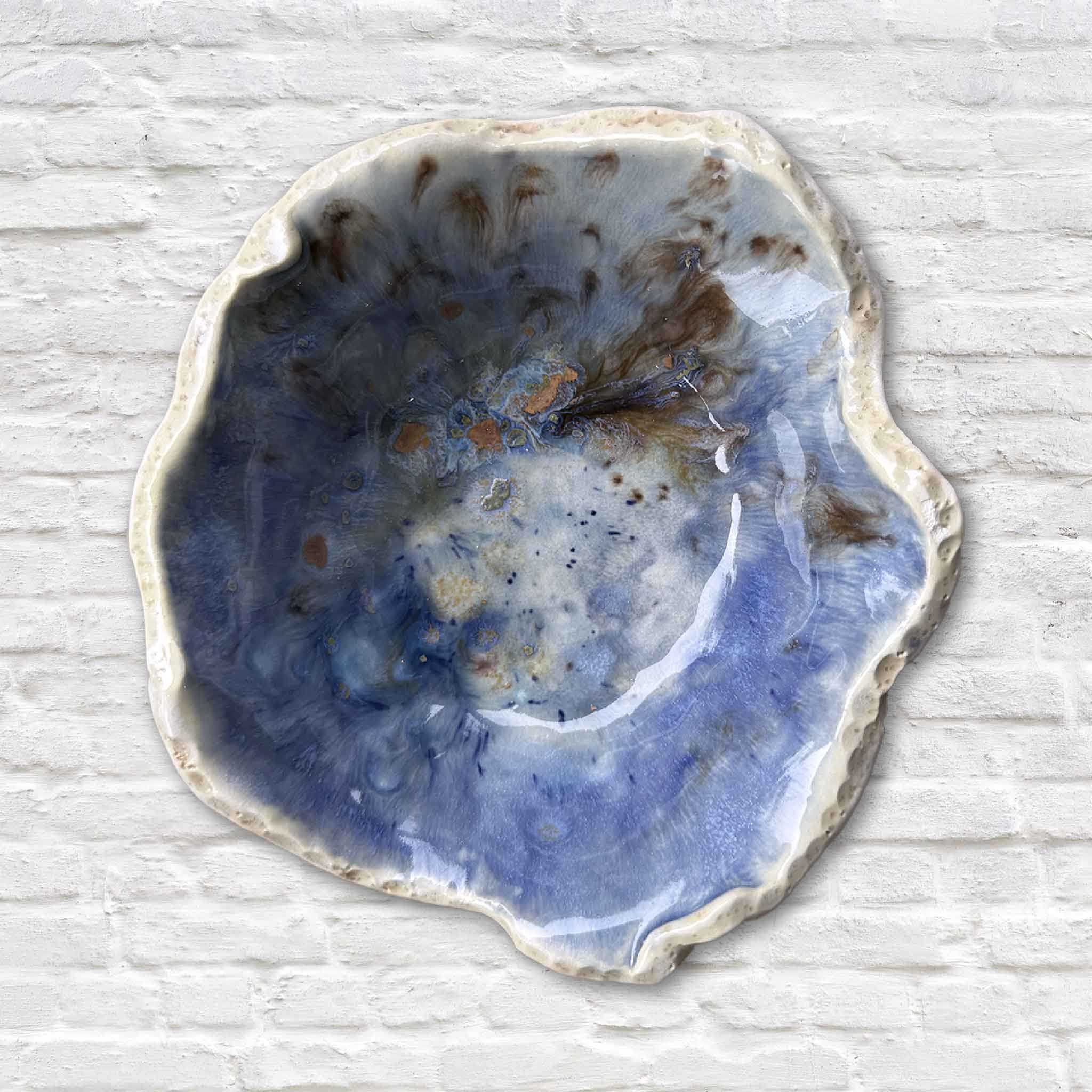 One-of-a-kind Seaspray pottery bowl by Vida Miller with swirling blue and coastal-inspired glaze.