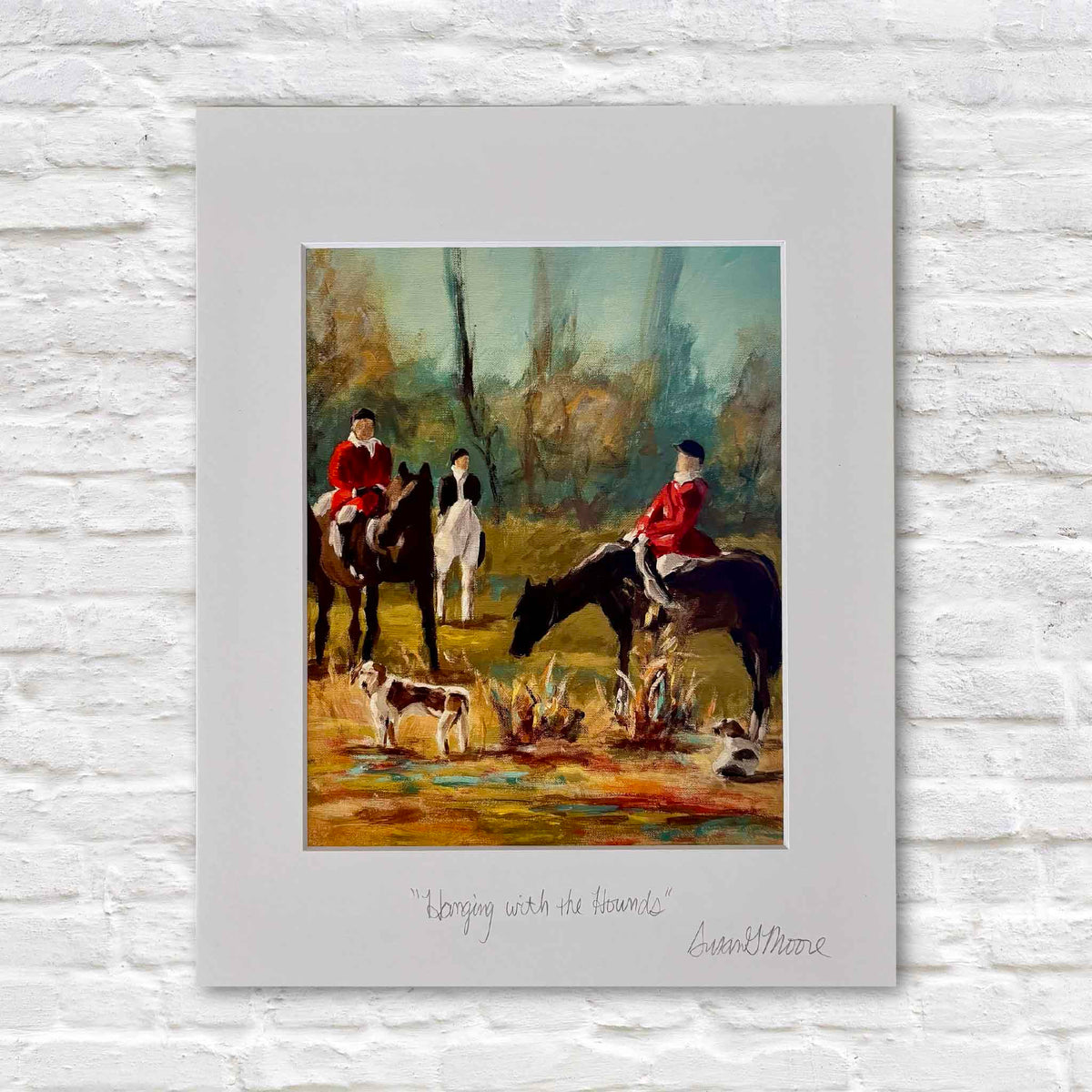 Hanging with the Hounds fine art giclée print by Susan Moore depicting equestrian riders on horseback in traditional red hunt coats gathered with foxhounds in a colorful woodland sporting scene, professionally matted and personally titled and signed by the artist, available at Gray Man Gallery in Pawleys Island, South Carolina.