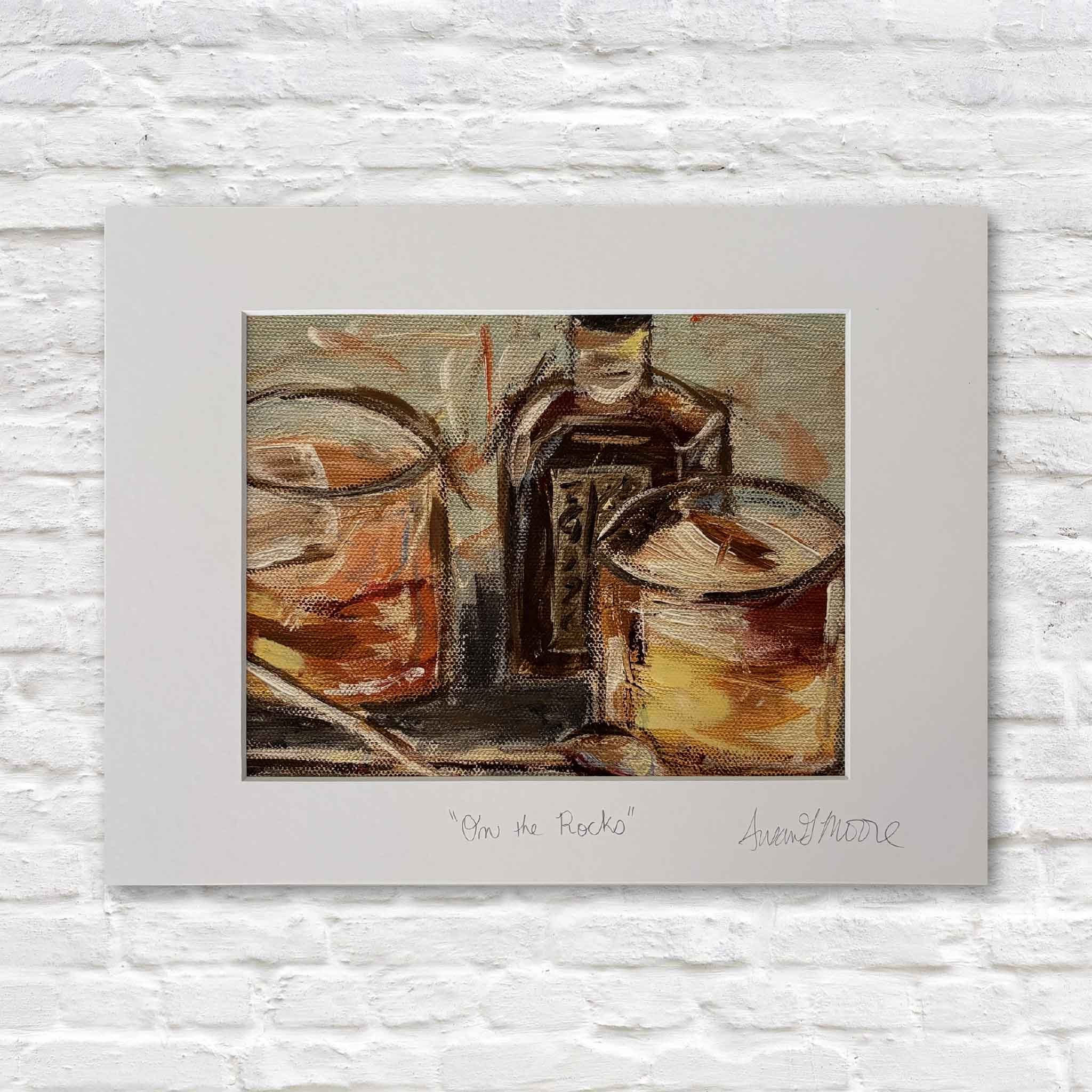 On the Rocks fine art print by Susan Moore featuring a warm still life of whiskey glasses and a bottle in rich amber, gold and brown tones, matted to a standard 11 x 14 size and available at Gray Man Gallery in Pawleys Island, South Carolina.