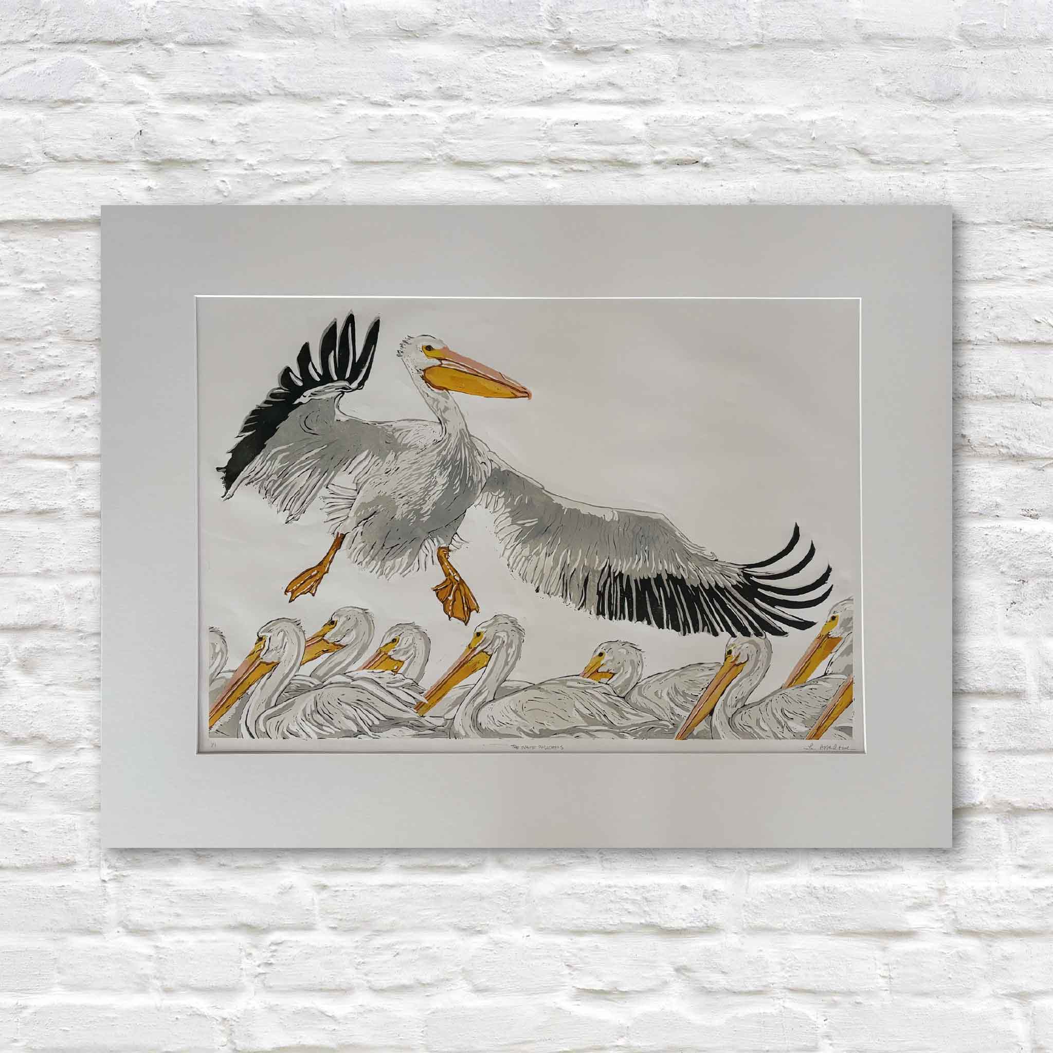 Original signed reduction linocut, The White Pelicans, by South Carolina artist Laurie Brownell McIntosh, professionally matted to a standard 36x24 size and available at Gray Man Gallery in Pawleys Island. This hand-pulled original oil reduction linocut features a flock of American white pelicans with one bird soaring overhead, showcasing Laurie's intricate carving, expressive linework, and masterful multi-layer reduction printing process.