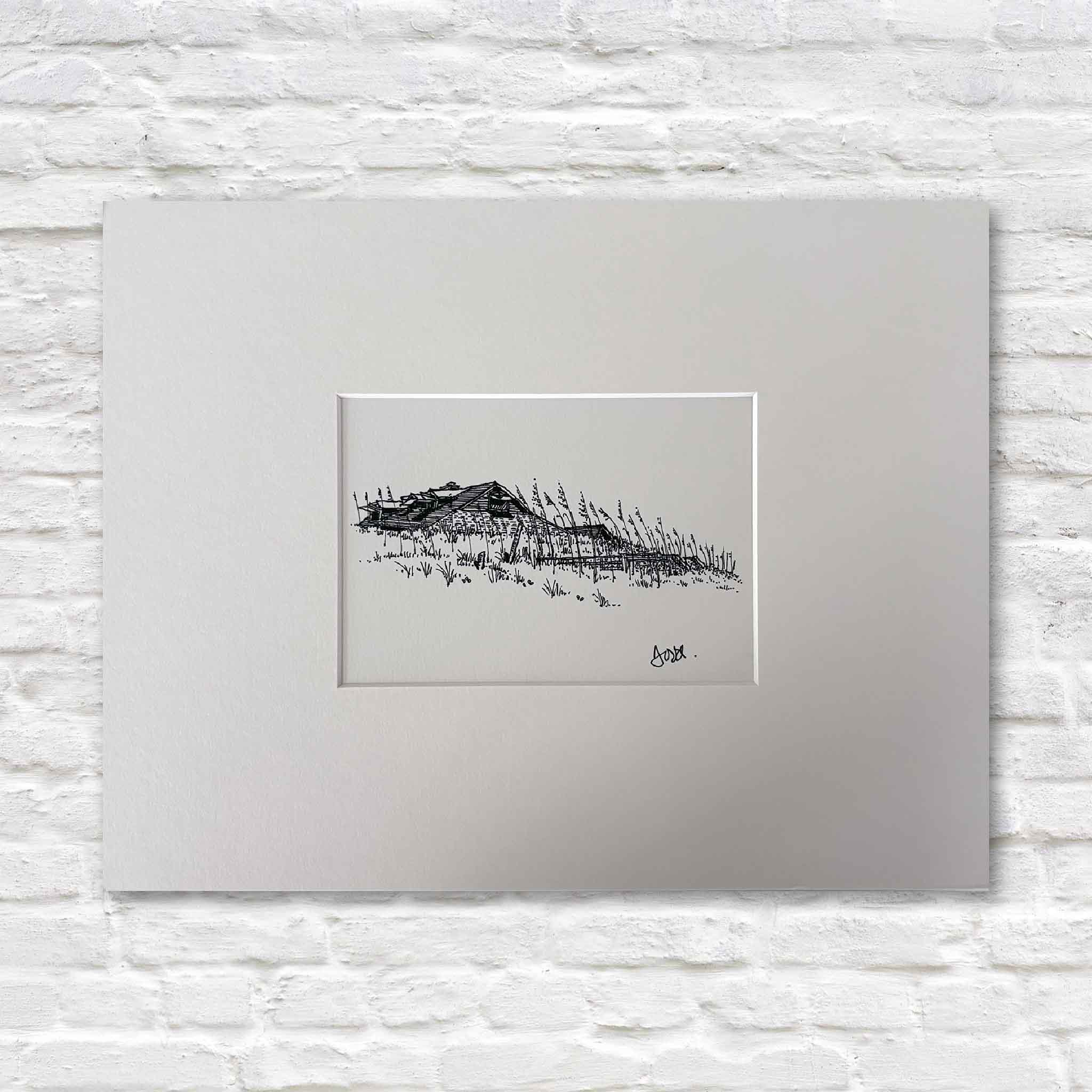 Matted fine art print titled Pawleys Beach House with Sea Oats by Pawleys Island artist Todd Halamka, available at Gray Man Gallery in Pawleys Island, South Carolina. The detailed pen-and-ink illustration depicts a classic beach house nestled behind sea oats along the dunes and is professionally matted to fit a standard ready-made frame with no custom framing required.